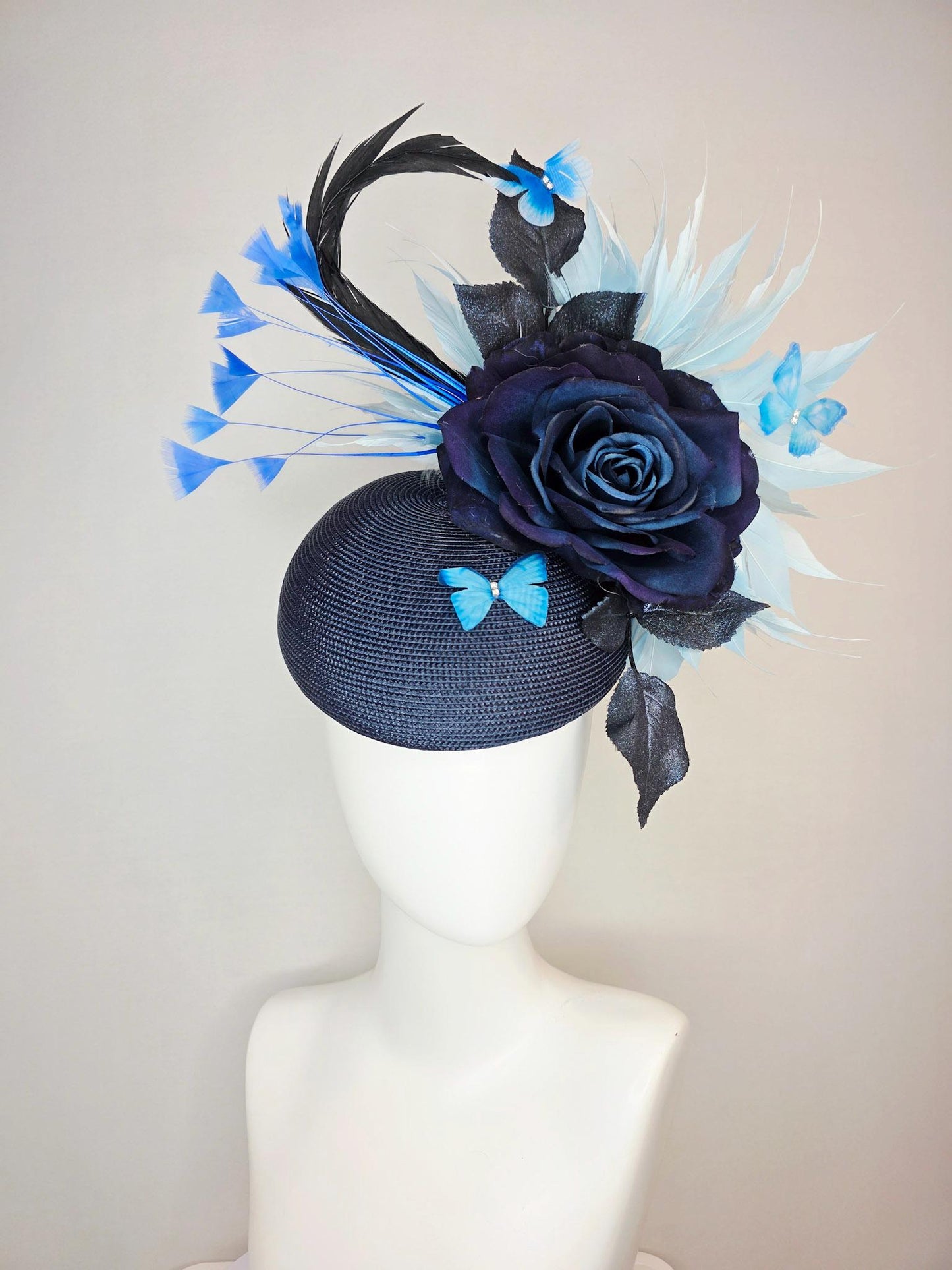 kentucky derby hat fascinator navy blue straw base large navy blue silk rose black leaves sky and baby blue feathers blue butterflies