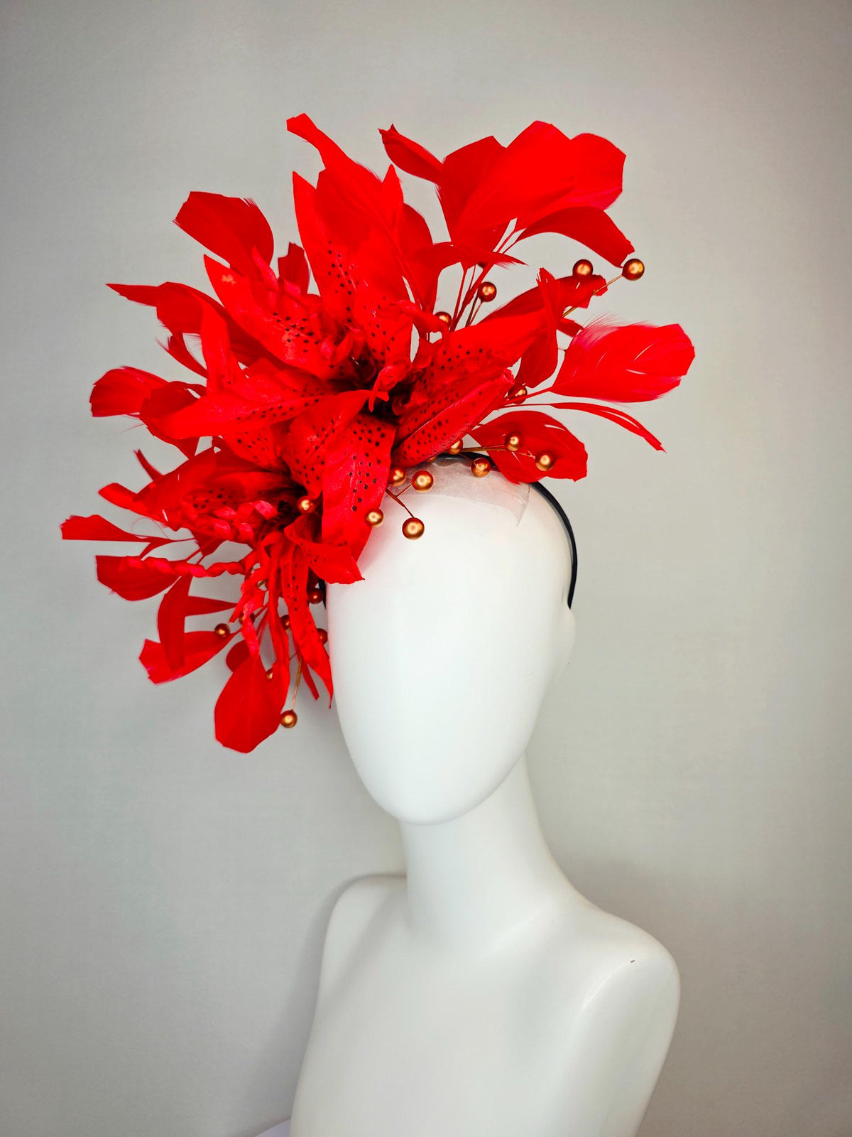 kentucky derby hat fascinator bright scarlet red satin lily flowers with gold pearls and bright red branching feathers