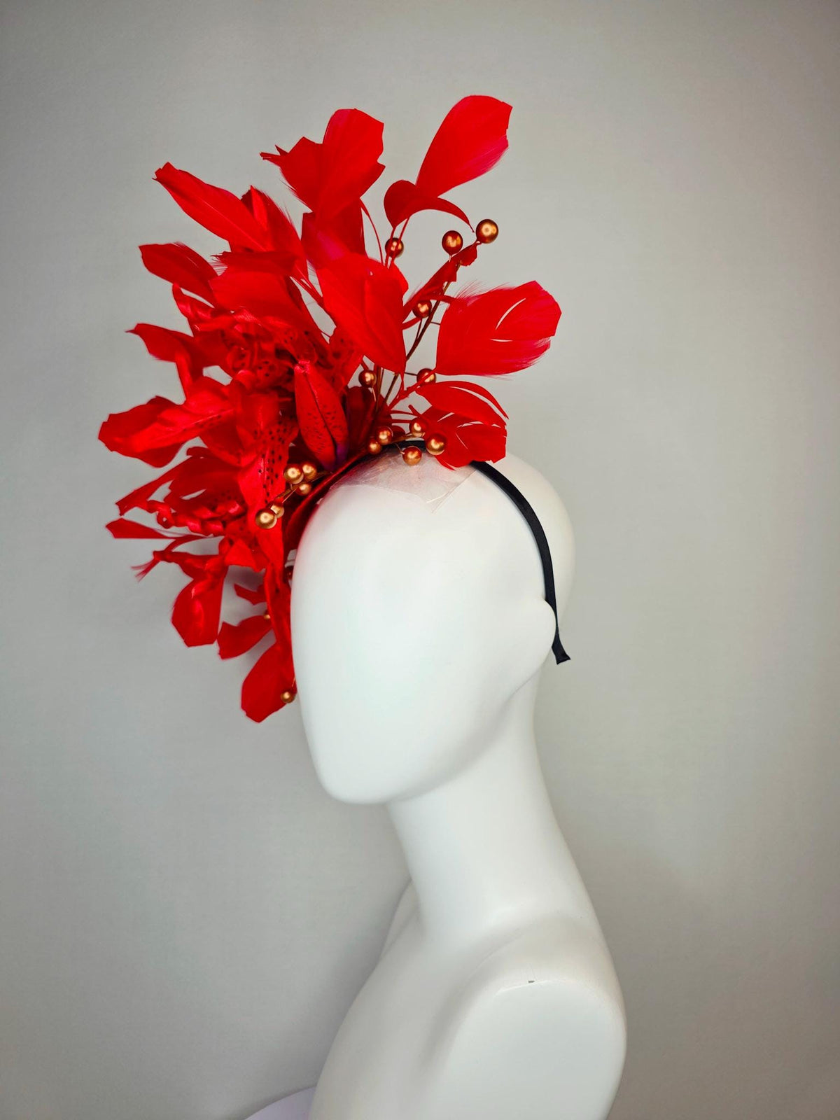 kentucky derby hat fascinator bright scarlet red satin lily flowers with gold pearls and bright red branching feathers