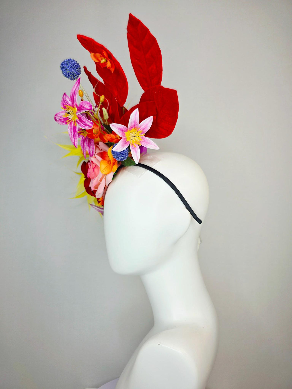 kentucky derby hat fascinator red light pink satin roses orange red pink magenta purple flowers blue thistle red leaves and yellow feathers