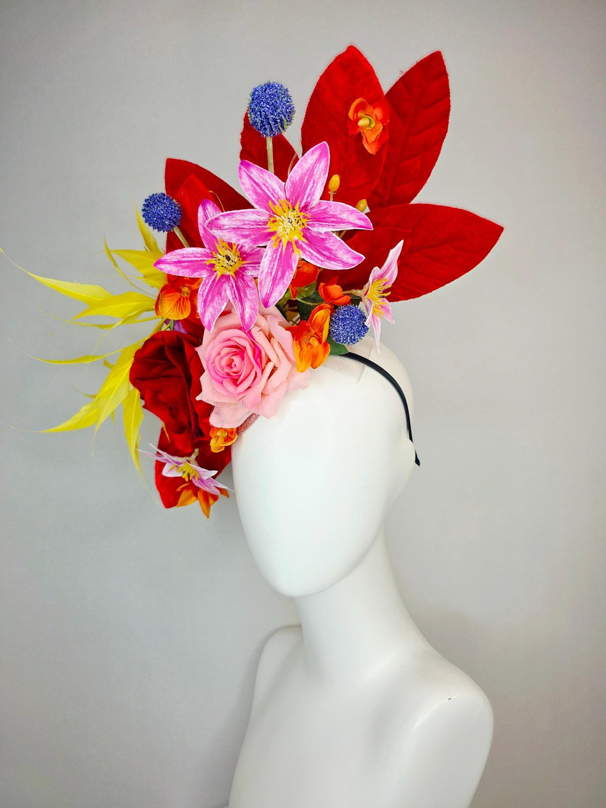 kentucky derby hat fascinator red light pink satin roses orange red pink magenta purple flowers blue thistle red leaves and yellow feathers