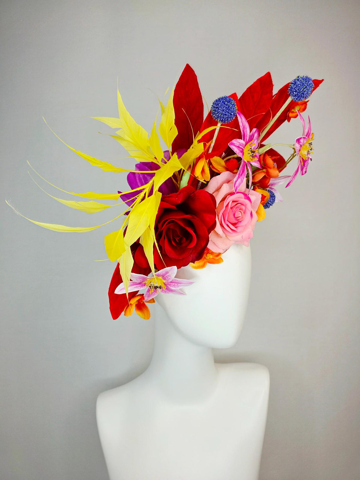 kentucky derby hat fascinator red light pink satin roses orange red pink magenta purple flowers blue thistle red leaves and yellow feathers