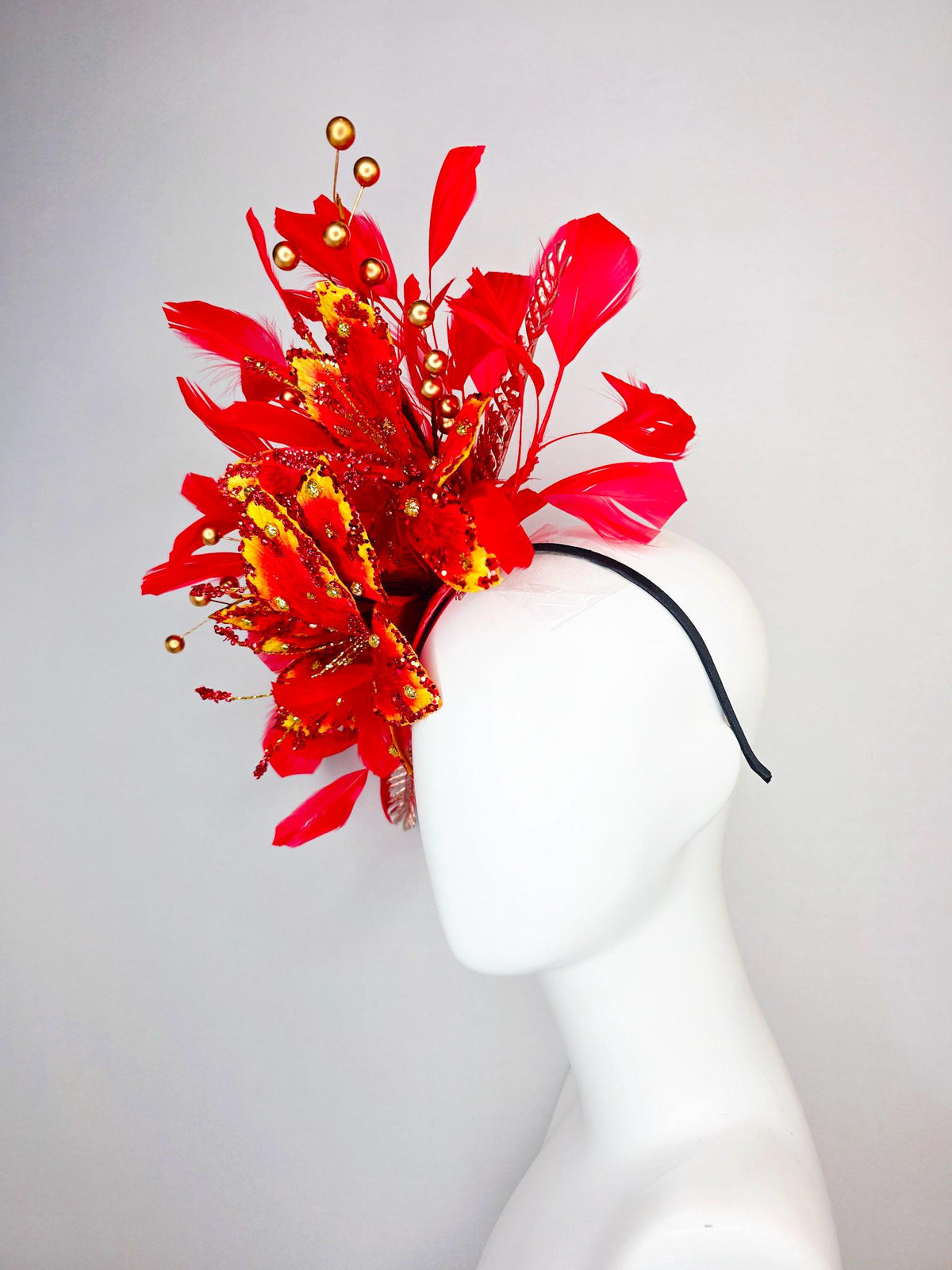 kentucky derby hat fascinator scarlet red and yellow with red sequin satin flowers bright red branching feathers and gold pearl stems