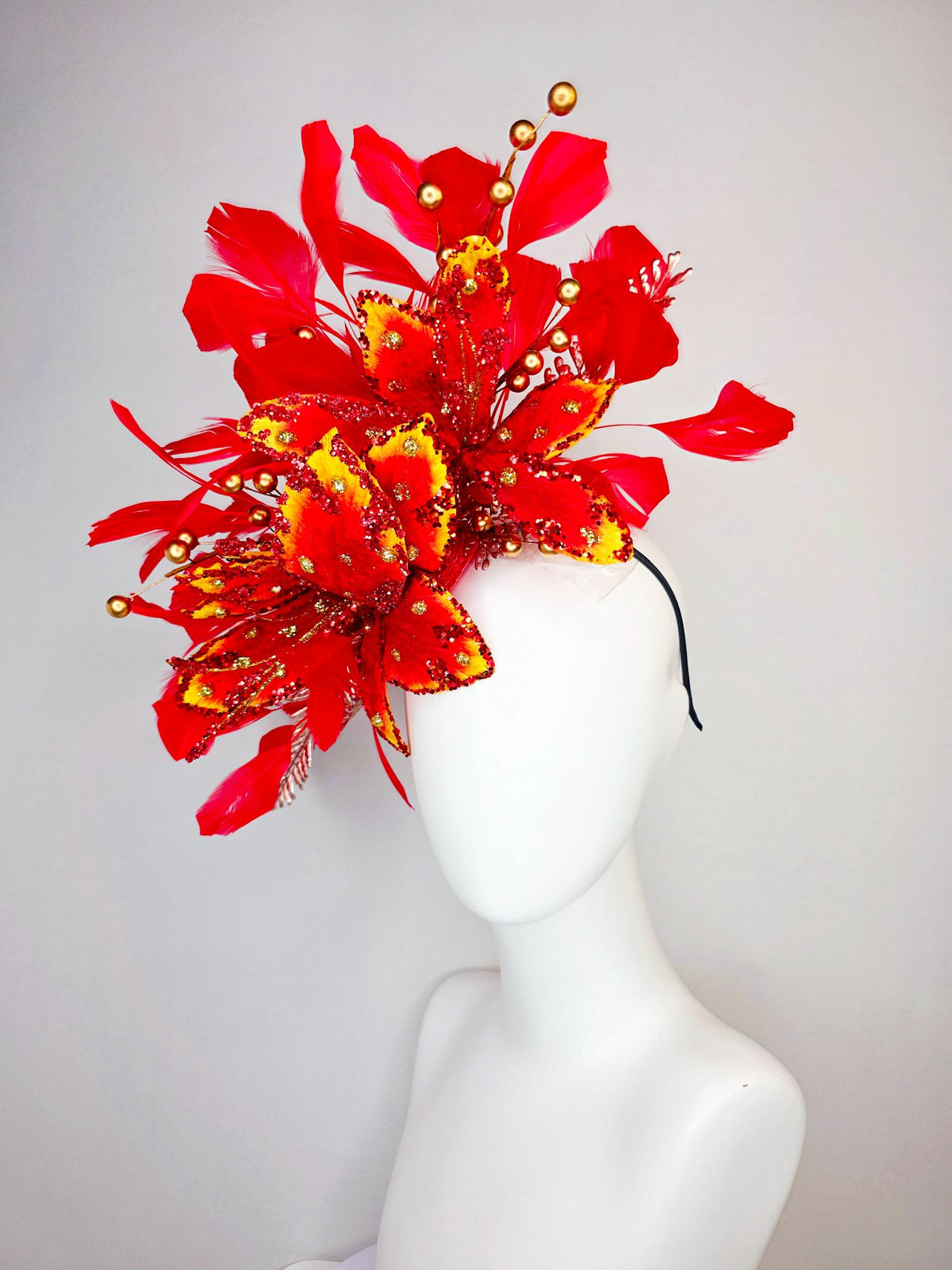 kentucky derby hat fascinator scarlet red and yellow with red sequin satin flowers bright red branching feathers and gold pearl stems