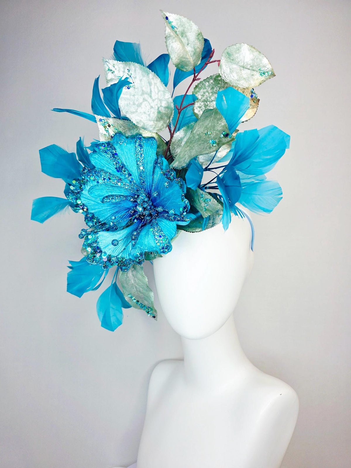 kentucky derby hat fascinator large with sky ocean blue satin flower with sequin silver sage green leaves turquoise blue branching feathers