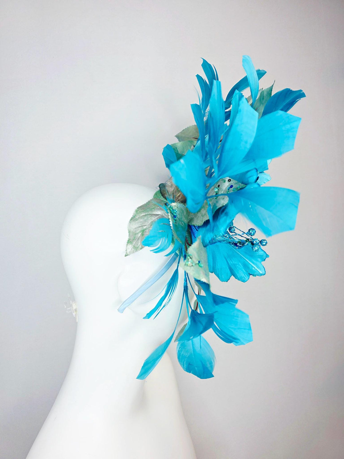 kentucky derby hat fascinator large with sky ocean blue satin flower with sequin silver sage green leaves turquoise blue branching feathers
