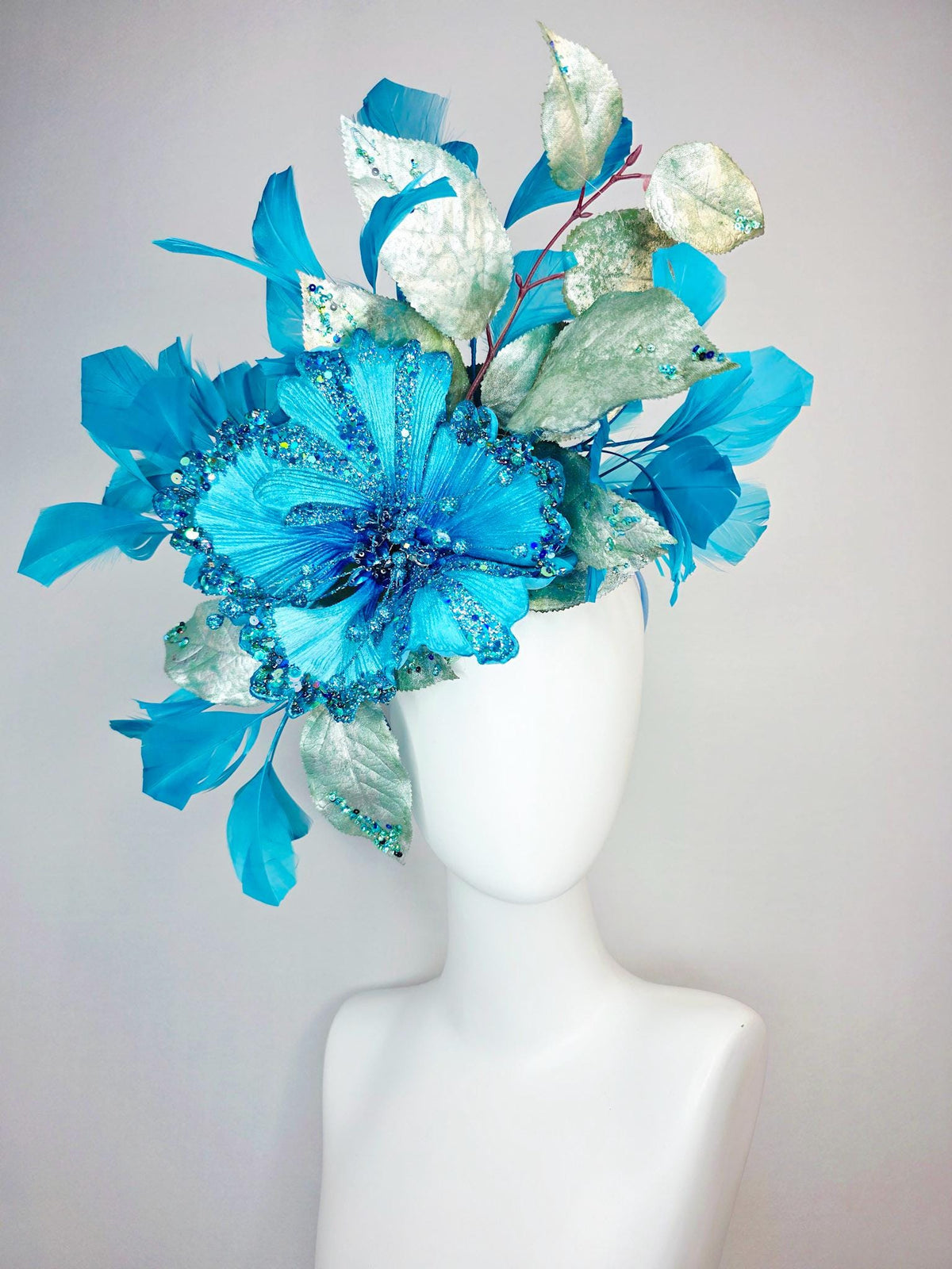 kentucky derby hat fascinator large with sky ocean blue satin flower with sequin silver sage green leaves turquoise blue branching feathers