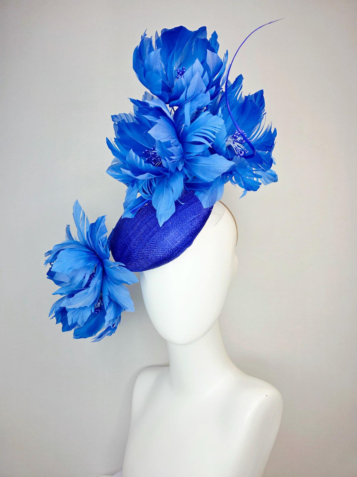 kentucky derby hat fascinator royal blue sinamay with large fluffy cobalt blue feather flowers and sky blue feathers