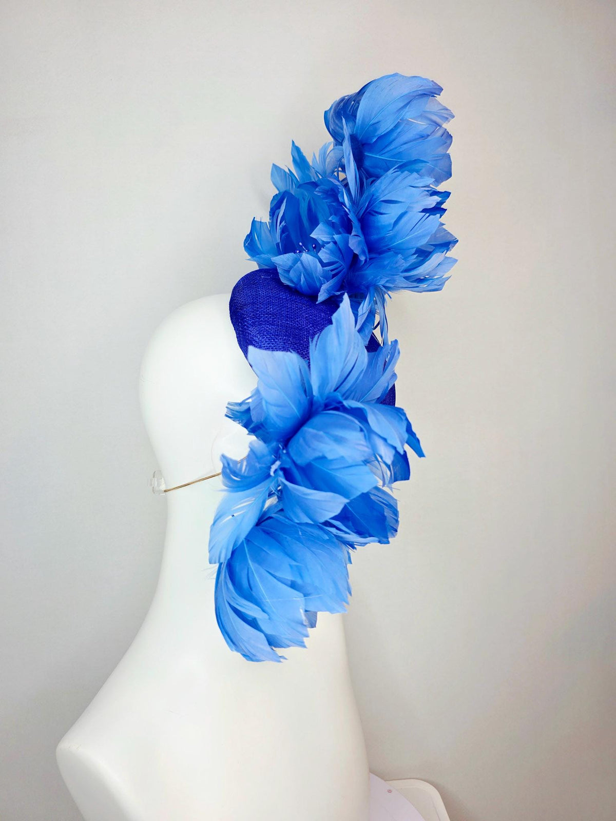 kentucky derby hat fascinator royal blue sinamay with large fluffy cobalt blue feather flowers and sky blue feathers