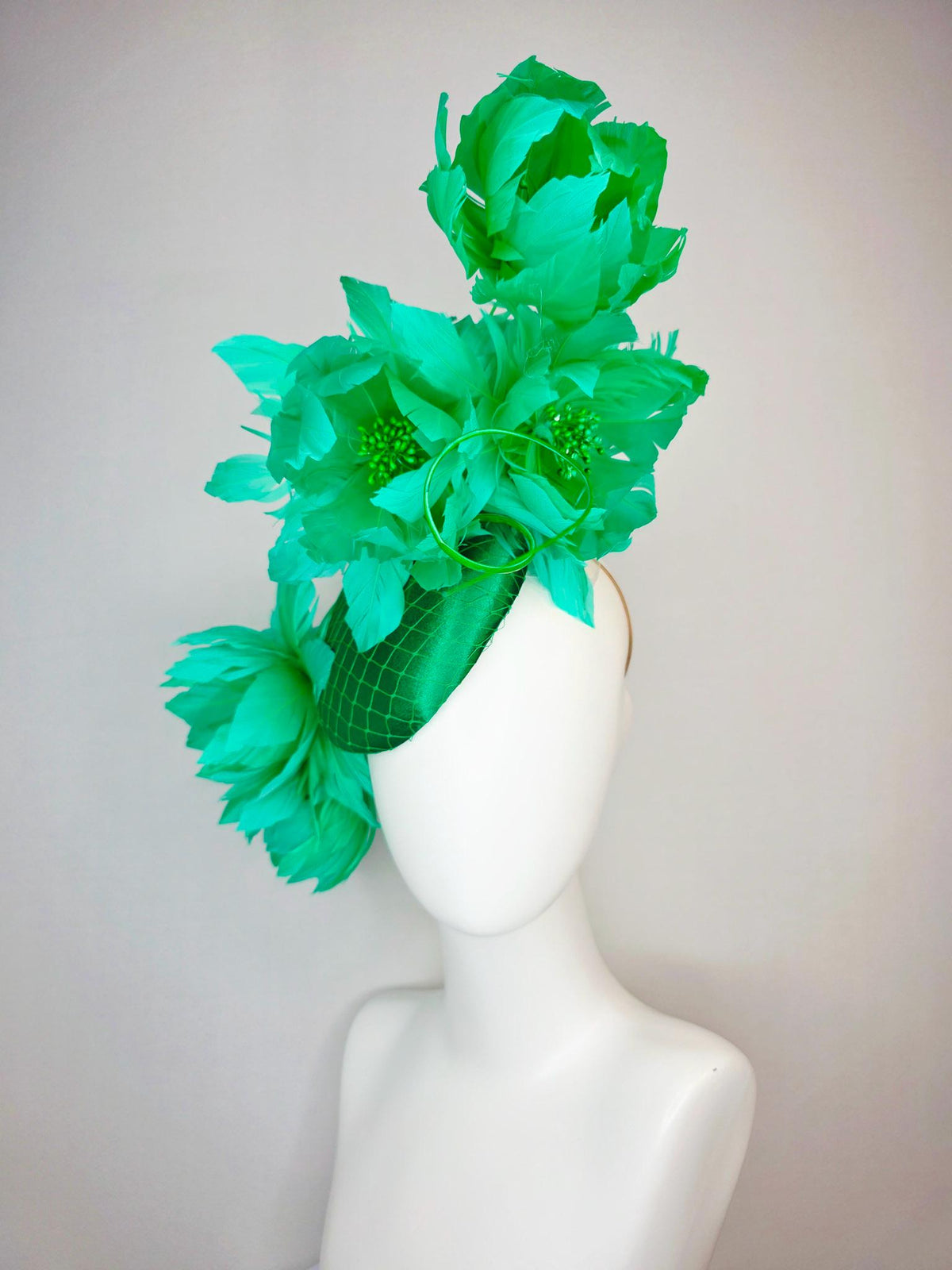 kentucky derby hat fascinator emerald green satin with netting and large fluffy green feather flowers and green feathers