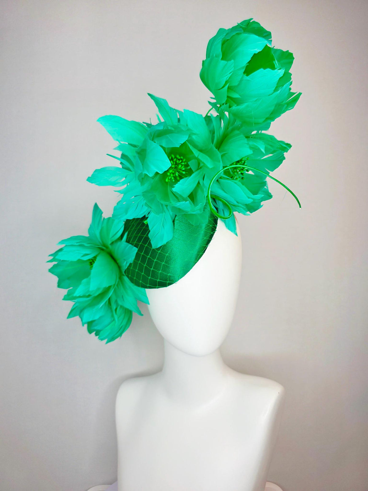 kentucky derby hat fascinator emerald green satin with netting and large fluffy green feather flowers and green feathers