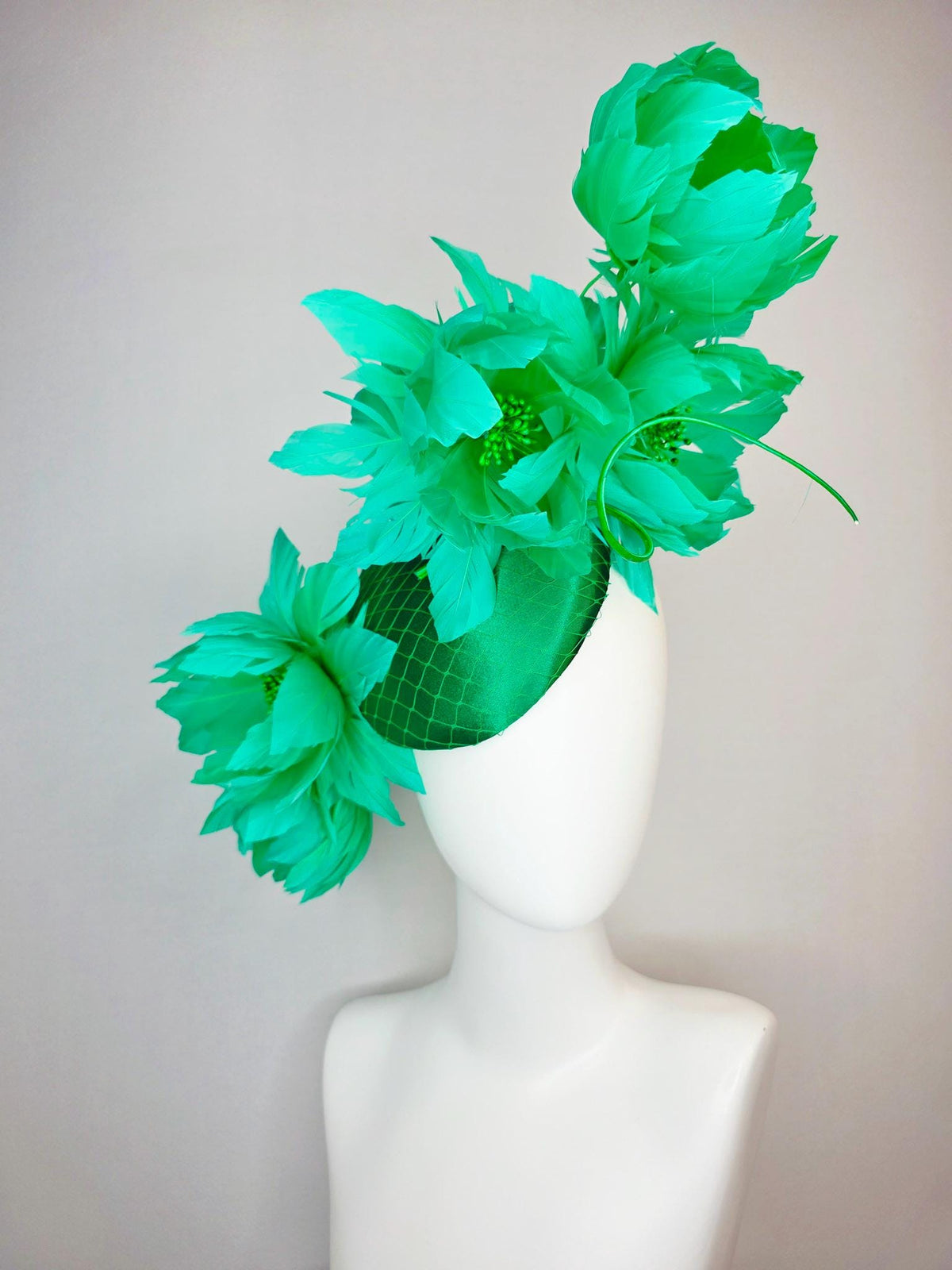 kentucky derby hat fascinator emerald green satin with netting and large fluffy green feather flowers and green feathers