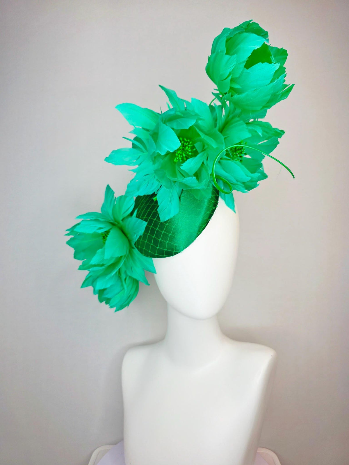 kentucky derby hat fascinator emerald green satin with netting and large fluffy green feather flowers and green feathers