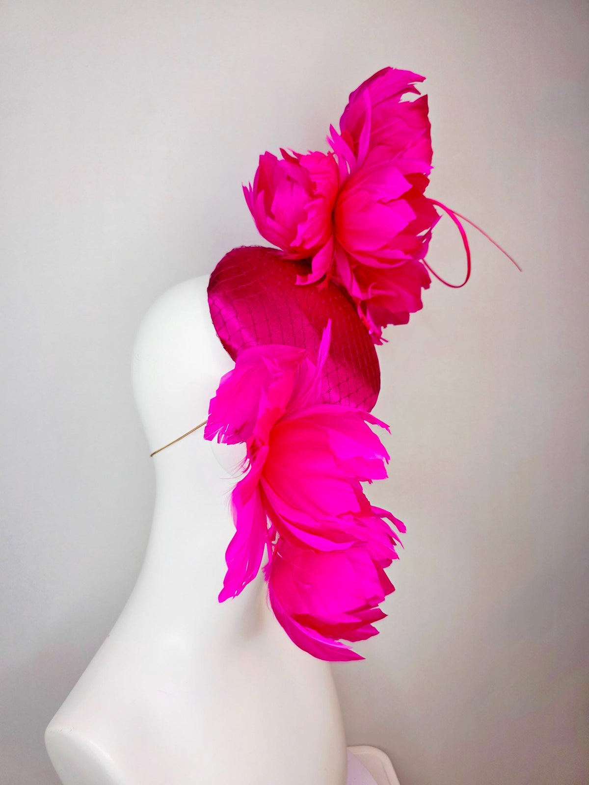 kentucky derby hat fascinator hot pink satin with netting and large fluffy hot red feather flowers with bright fuchsia pink feathers