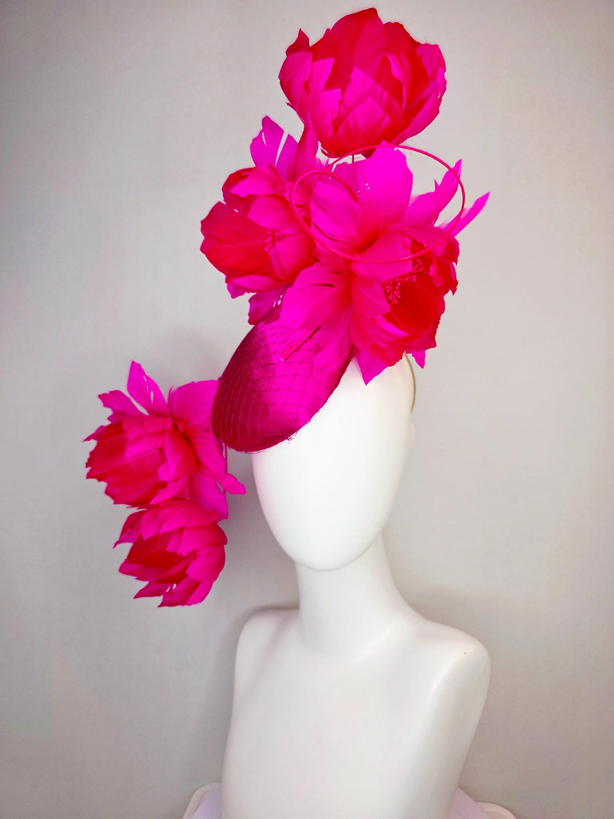 kentucky derby hat fascinator hot pink satin with netting and large fluffy hot red feather flowers with bright fuchsia pink feathers