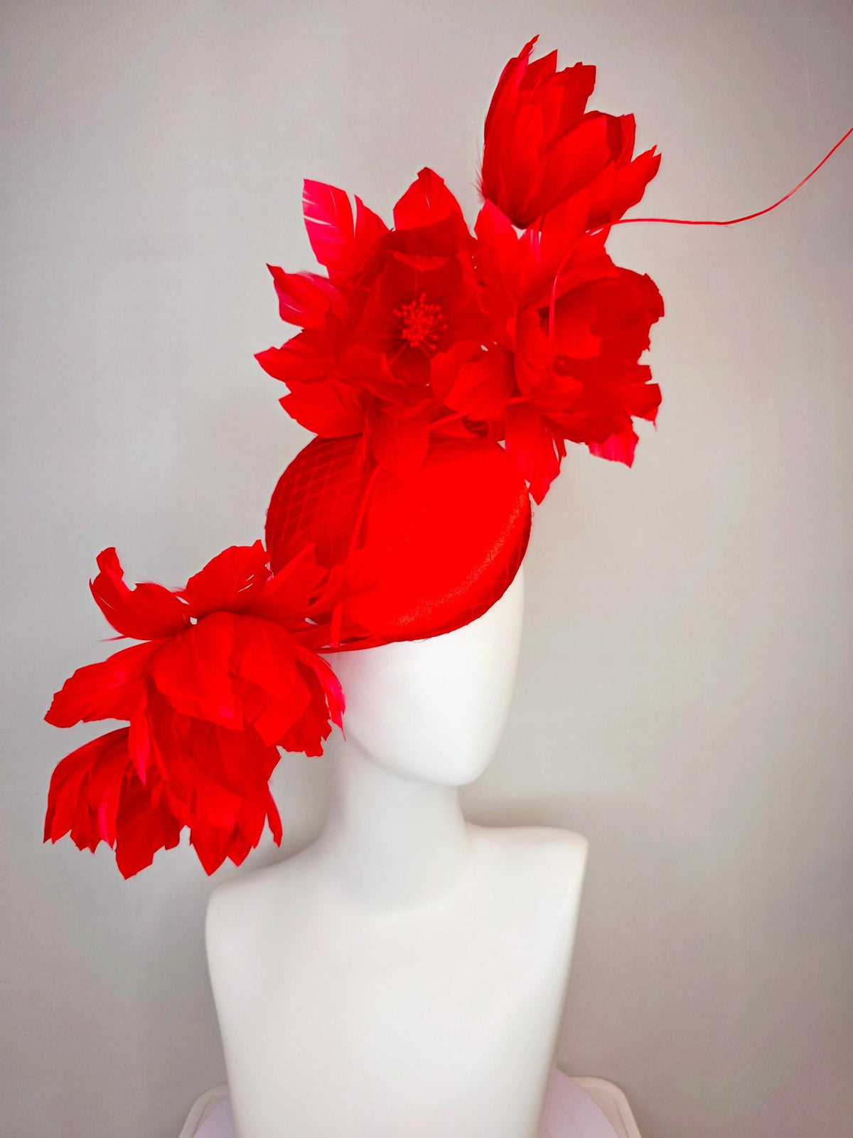 kentucky derby hat fascinator bright red satin with netting and large fluffy bright scarlet red feather flowers and red feathers