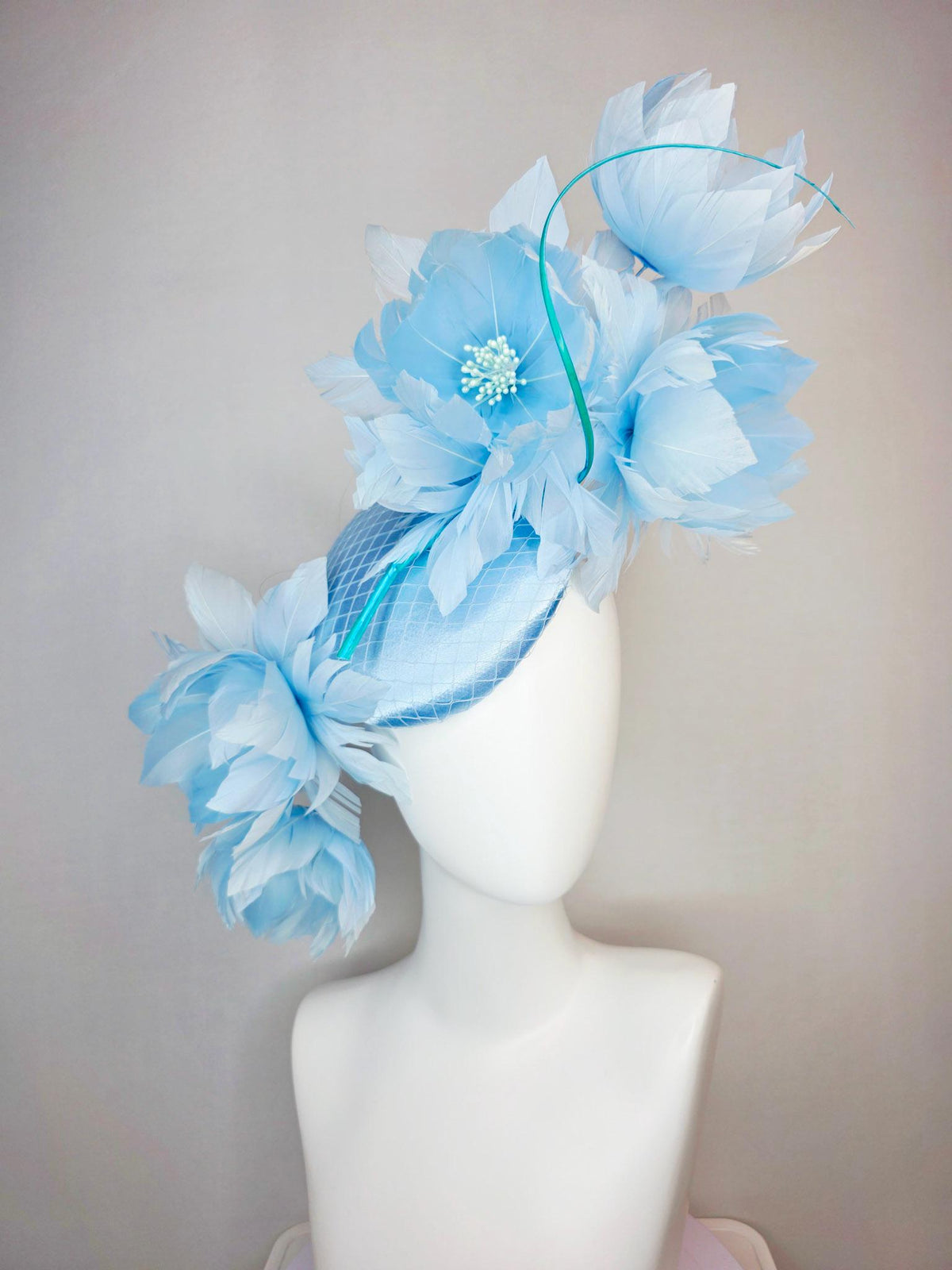 kentucky derby hat fascinator light blue satin with netting and large fluffy sky blue feather flowers and baby blue feathers