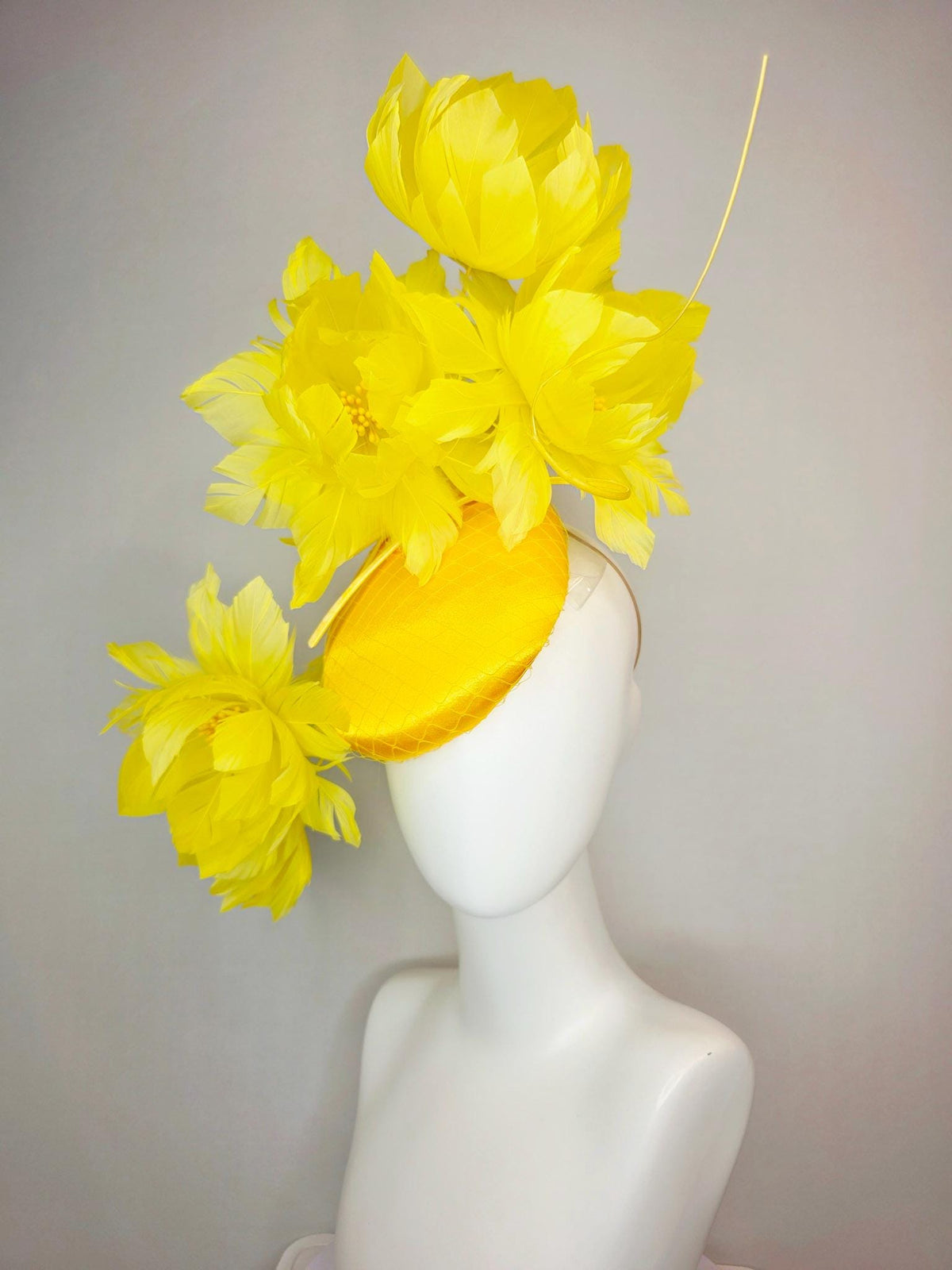 kentucky derby hat fascinator gold yellow satin with netting and large fluffy yellow feather flowers and yellow feathers