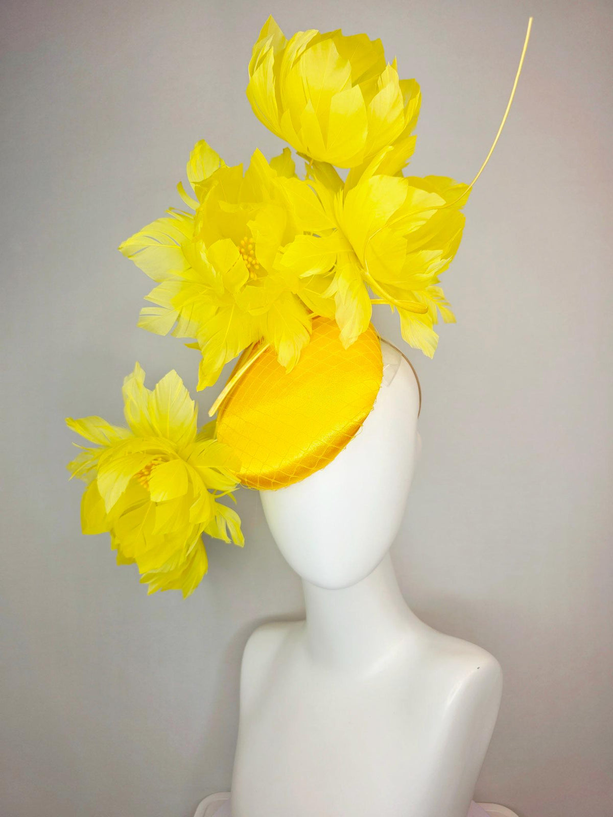 kentucky derby hat fascinator gold yellow satin with netting and large fluffy yellow feather flowers and yellow feathers