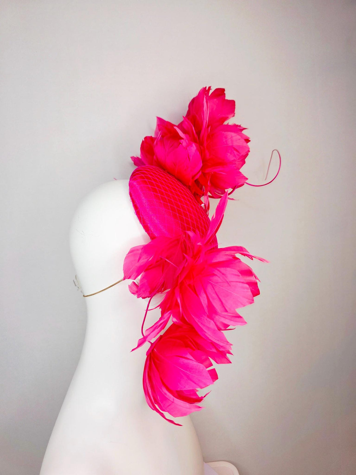 kentucky derby hat fascinator hot raspberry pink satin with netting and large fluffy red feather flowers with fuchsia pink feathers