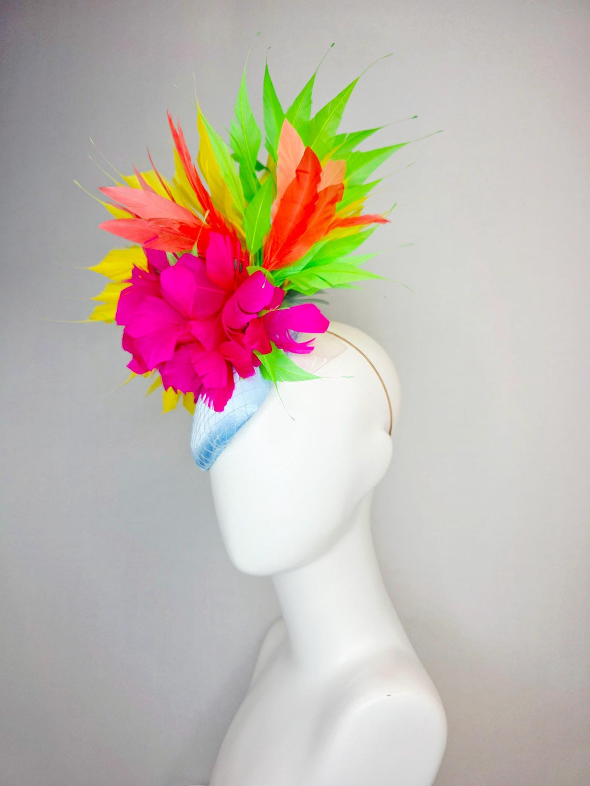 kentucky derby hat fascinator light blue satin with netting fuchsia pink fluffy feathers and yellow orange lime green branching feathers