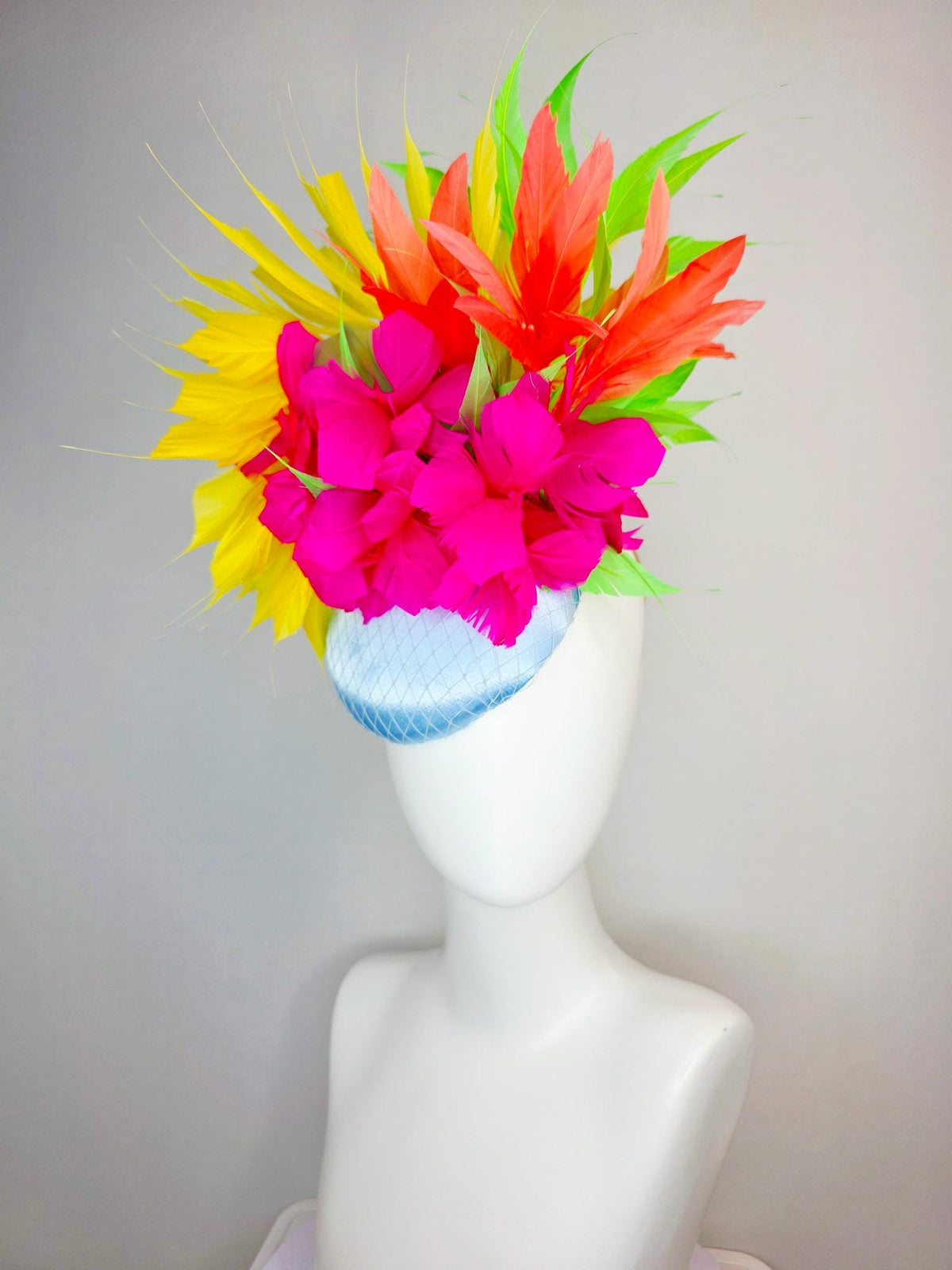 kentucky derby hat fascinator light blue satin with netting fuchsia pink fluffy feathers and yellow orange lime green branching feathers
