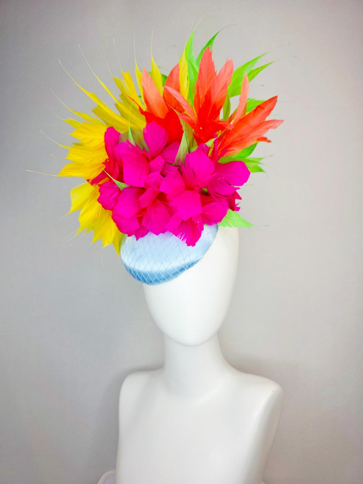 kentucky derby hat fascinator light blue satin with netting fuchsia pink fluffy feathers and yellow orange lime green branching feathers