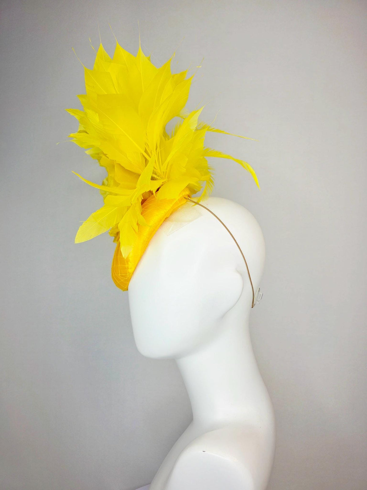 kentucky derby hat fascinator bright yellow satin with netting large yellow organza rose with yellow leaves and yellow branching feathers