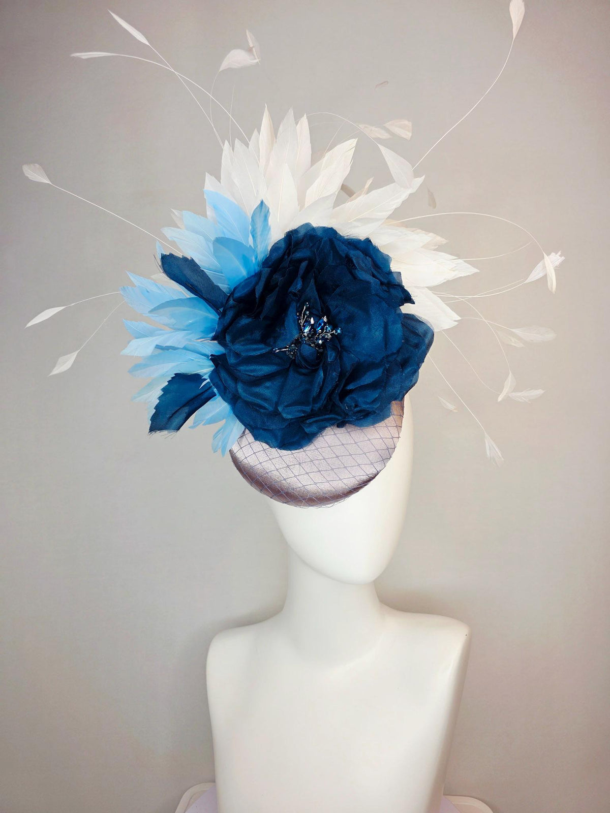kentucky derby hat fascinator silver gray satin with netting large navy blue organza rose flower with sky blue and white branching feathers