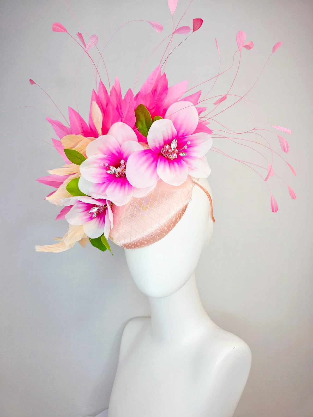kentucky derby hat fascinator light pink satin with netting pink white satin flowers green leaves cream beige and hot pink fluffy feathers