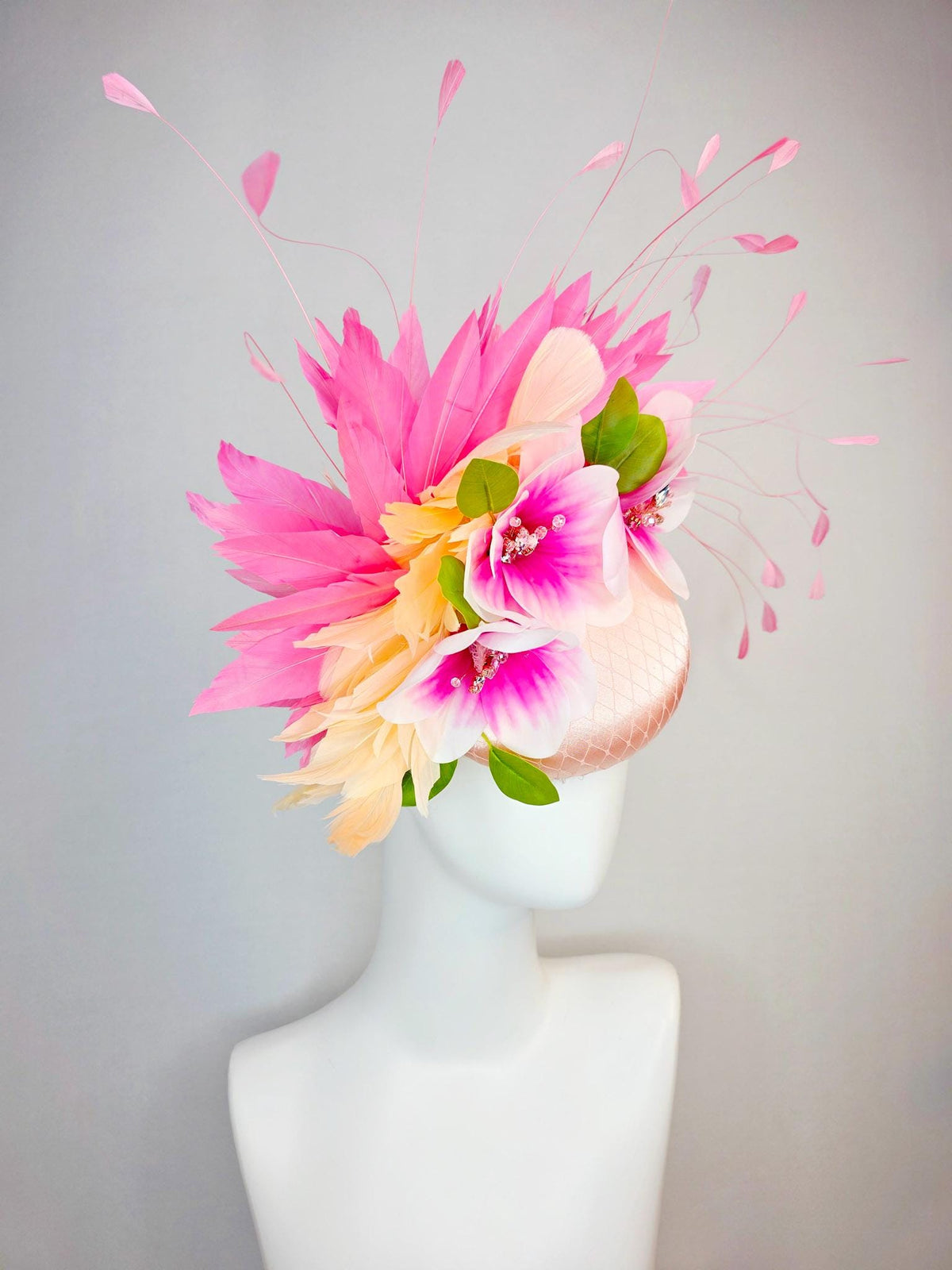 kentucky derby hat fascinator light pink satin with netting pink white satin flowers green leaves cream beige and hot pink fluffy feathers