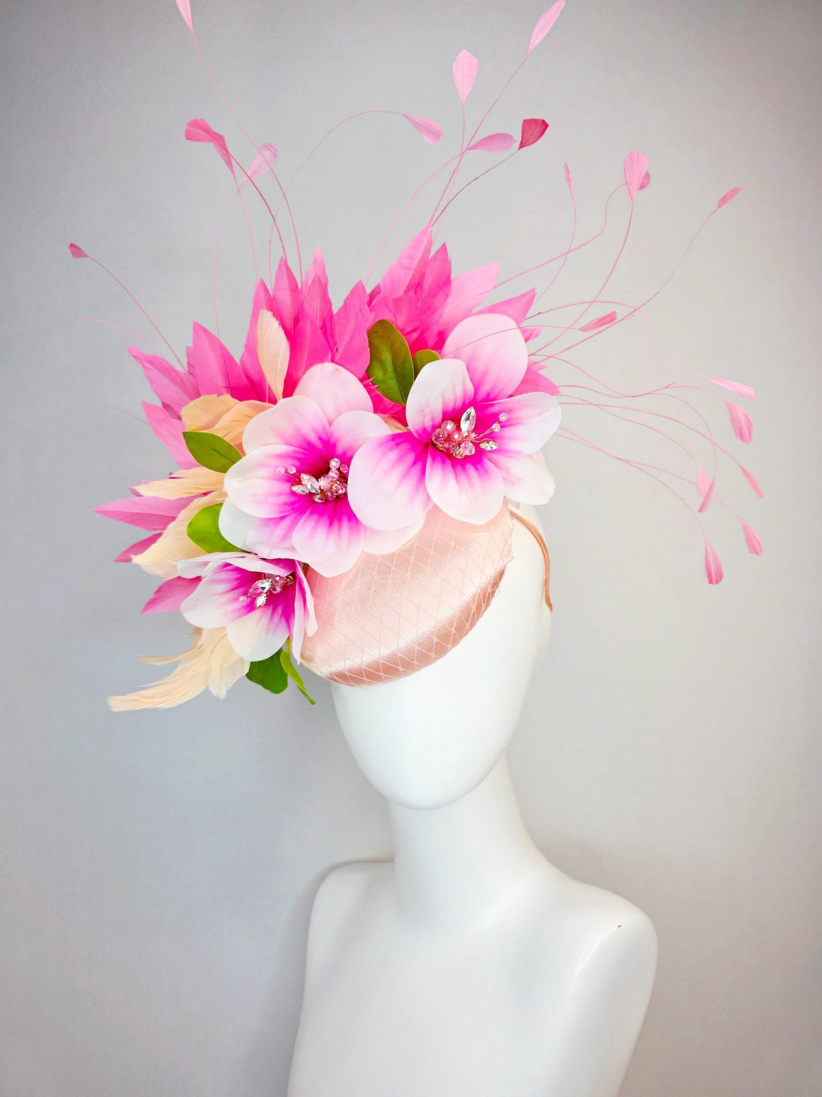 kentucky derby hat fascinator light pink satin with netting pink white satin flowers green leaves cream beige and hot pink fluffy feathers