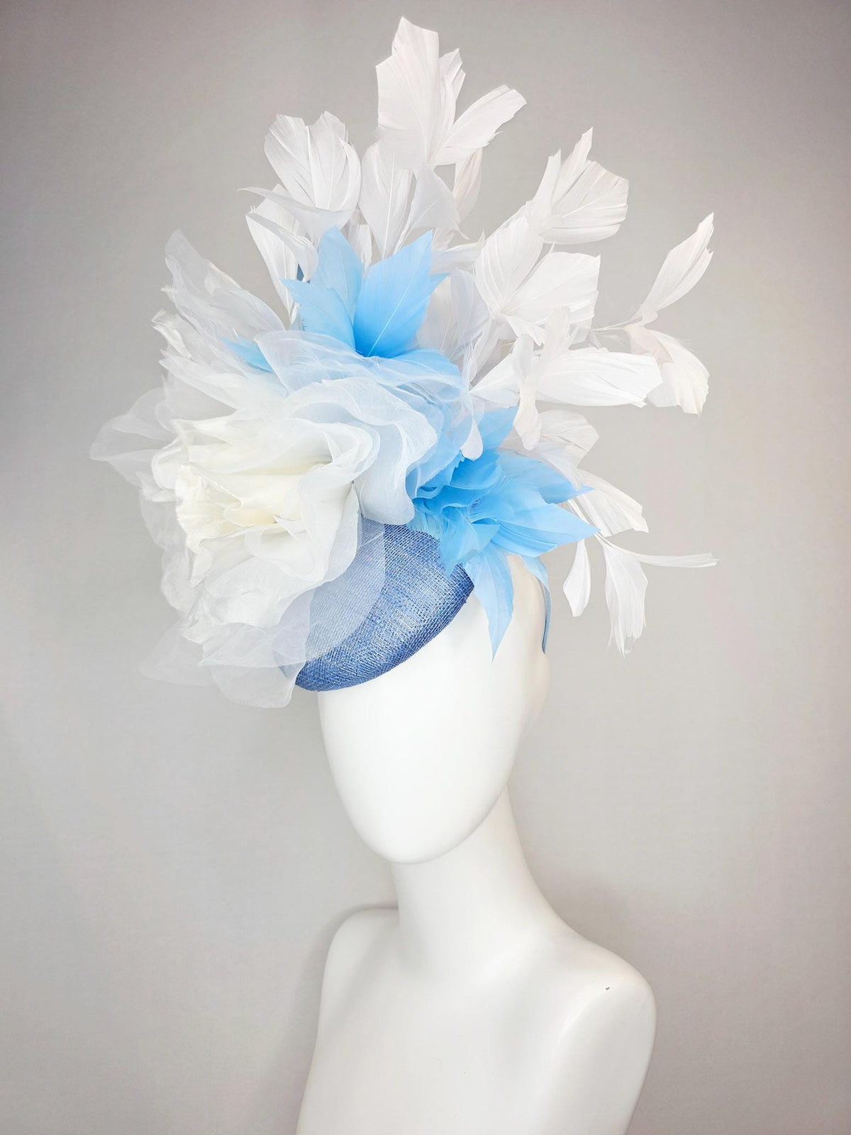 kentucky derby hat fascinator denim blue sinamay with large ivory white organza rose flower sky blue and white branching feathers