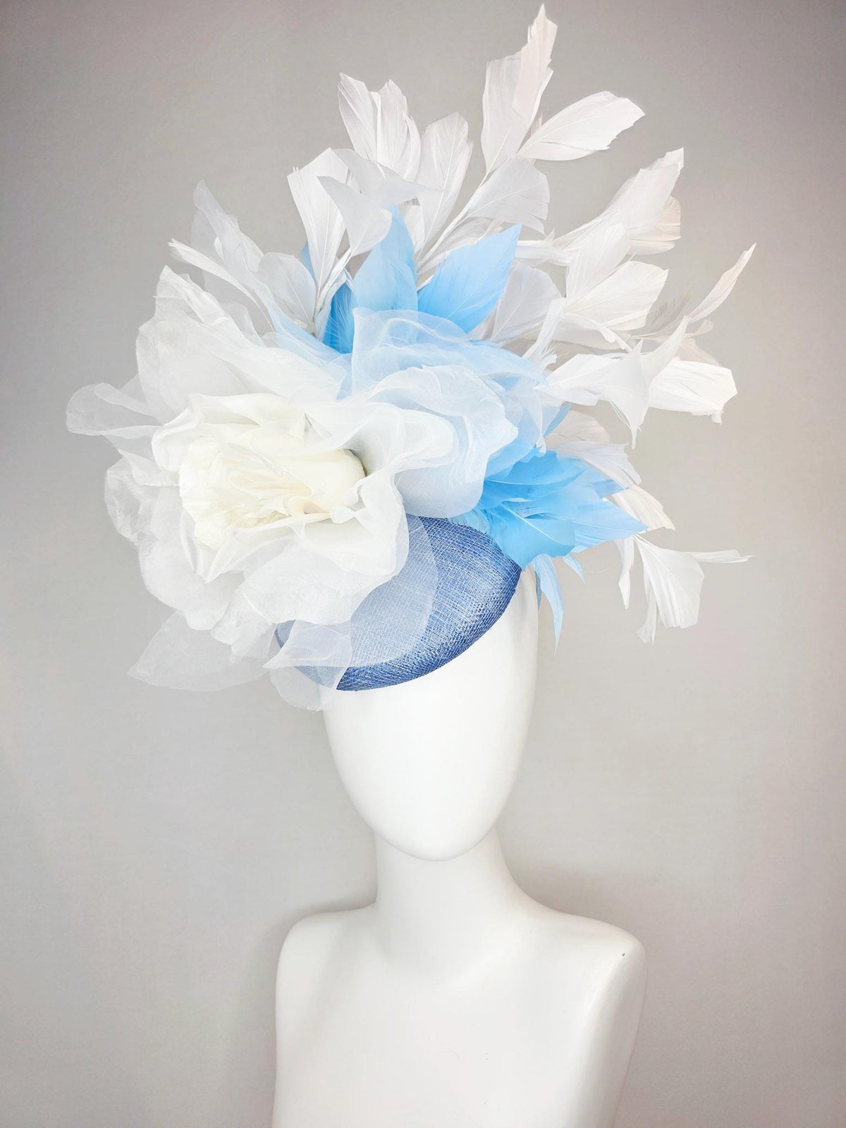 kentucky derby hat fascinator denim blue sinamay with large ivory white organza rose flower sky blue and white branching feathers