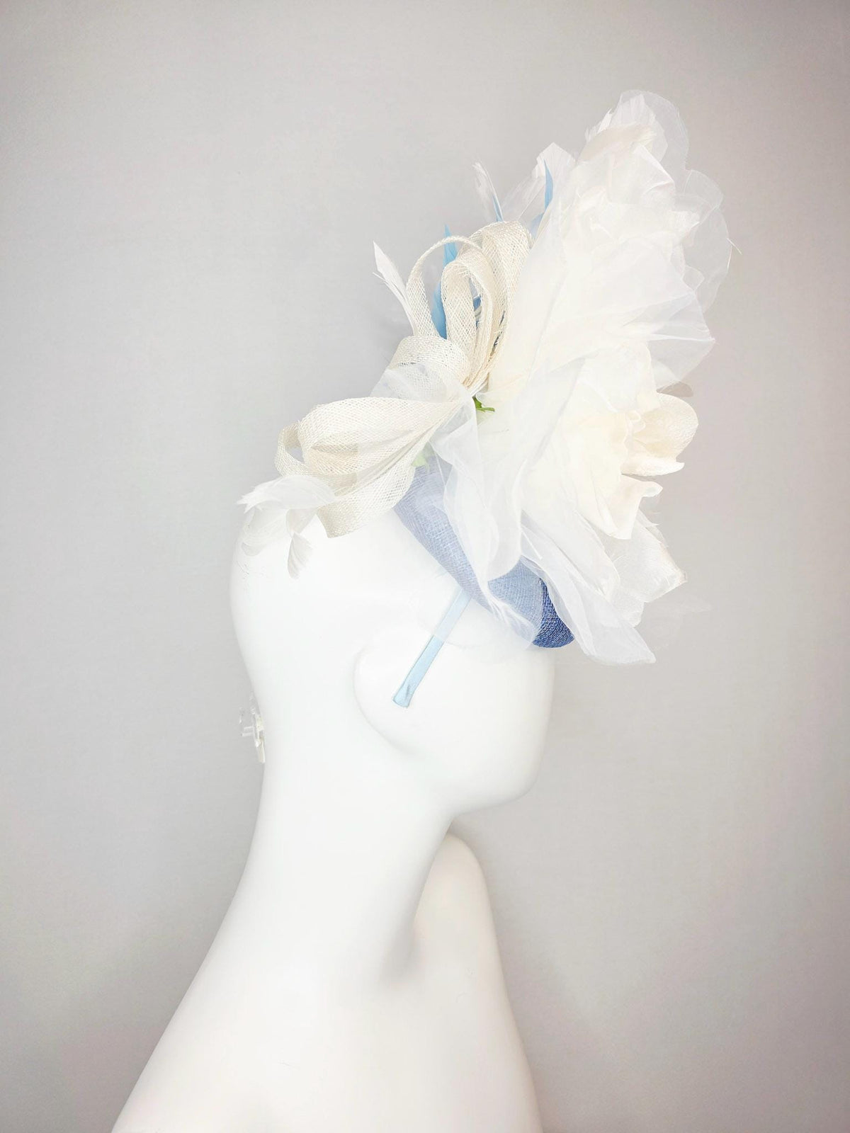 kentucky derby hat fascinator denim blue sinamay with large ivory white organza rose flower sky blue and white branching feathers