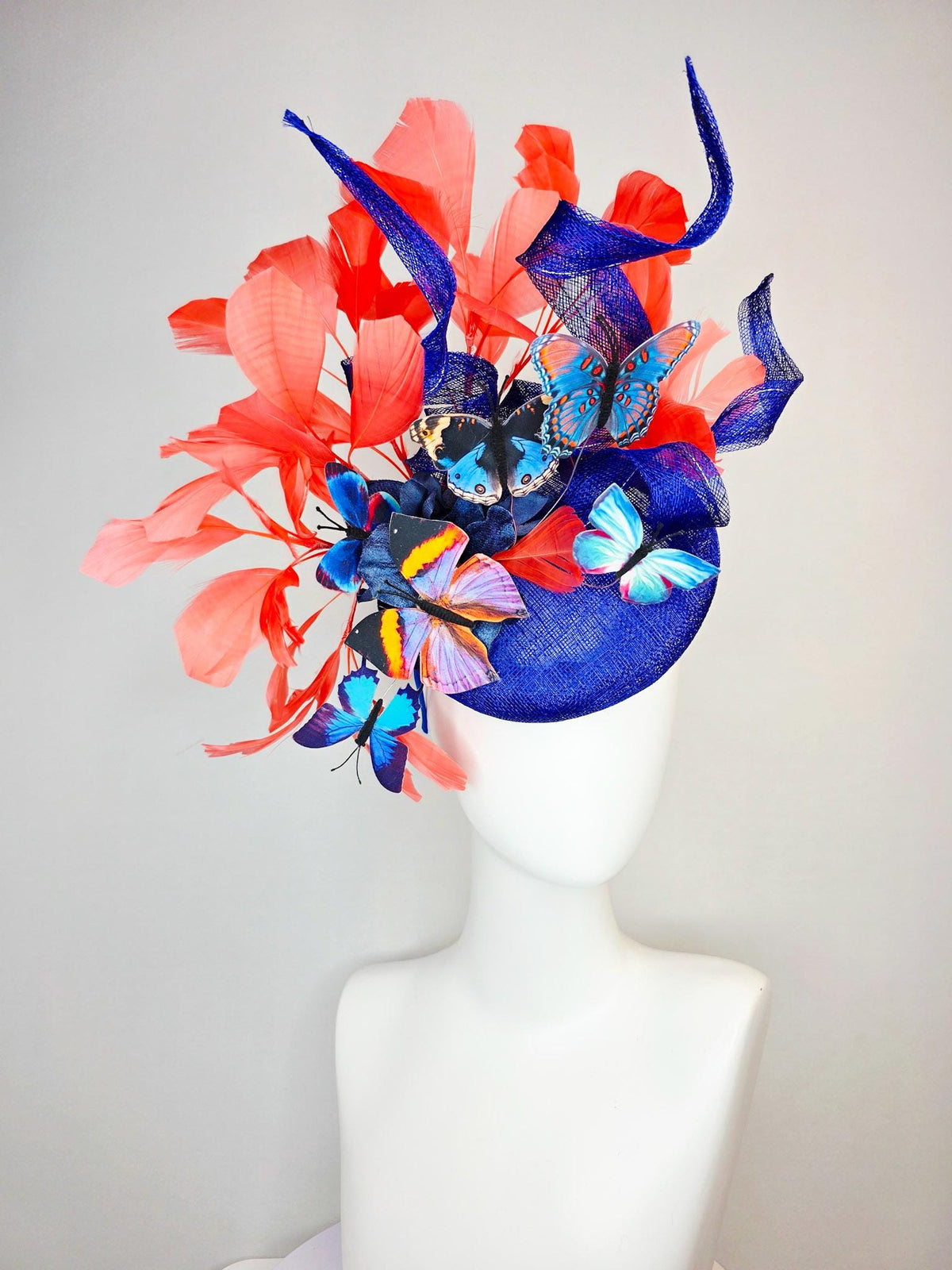 kentucky derby hat fascinator cobalt blue sinamay with curls royal blue organza flower coral orange feathers blue yellow black butterflies