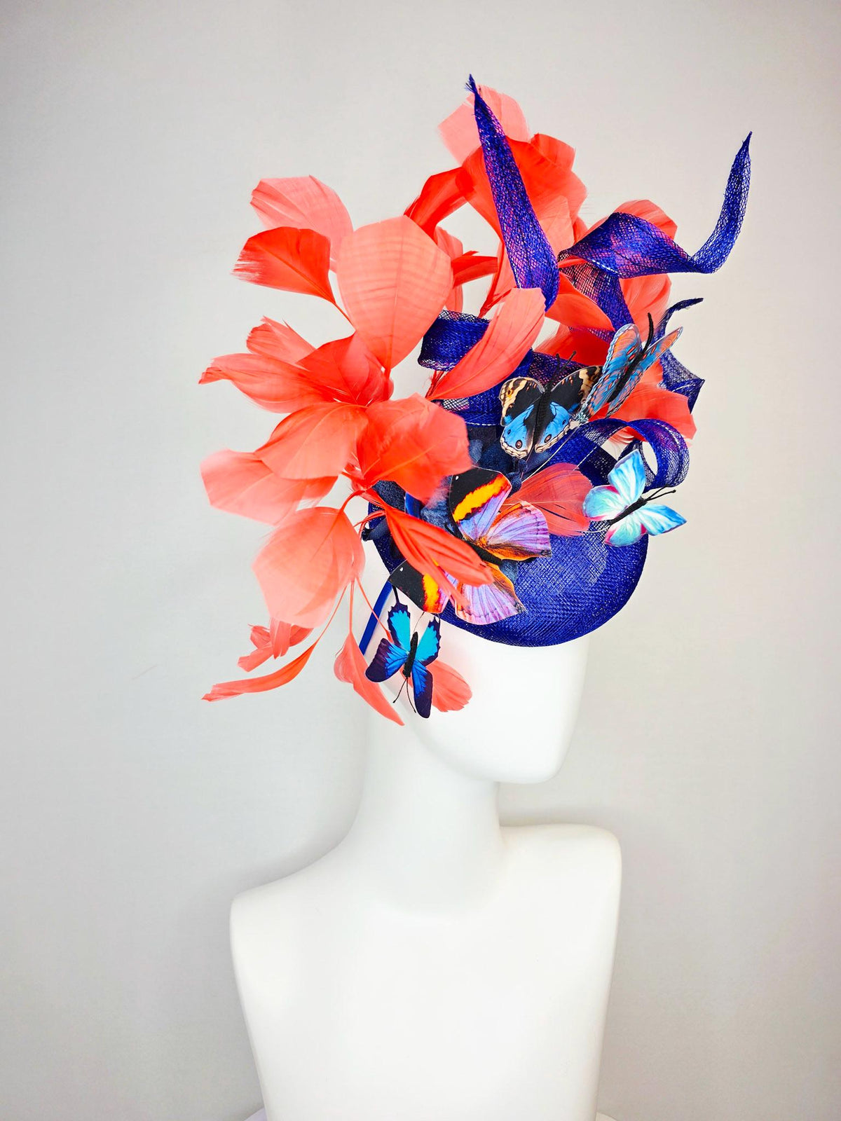 kentucky derby hat fascinator cobalt blue sinamay with curls royal blue organza flower coral orange feathers blue yellow black butterflies