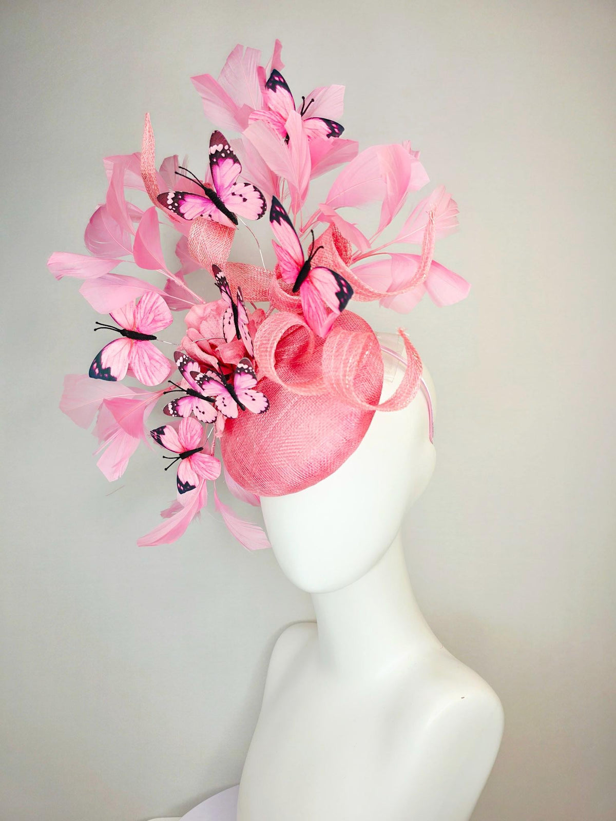 kentucky derby hat fascinator dusty pink sinamay with curls rose pink organza flower baby pink feathers light pink and black butterflies