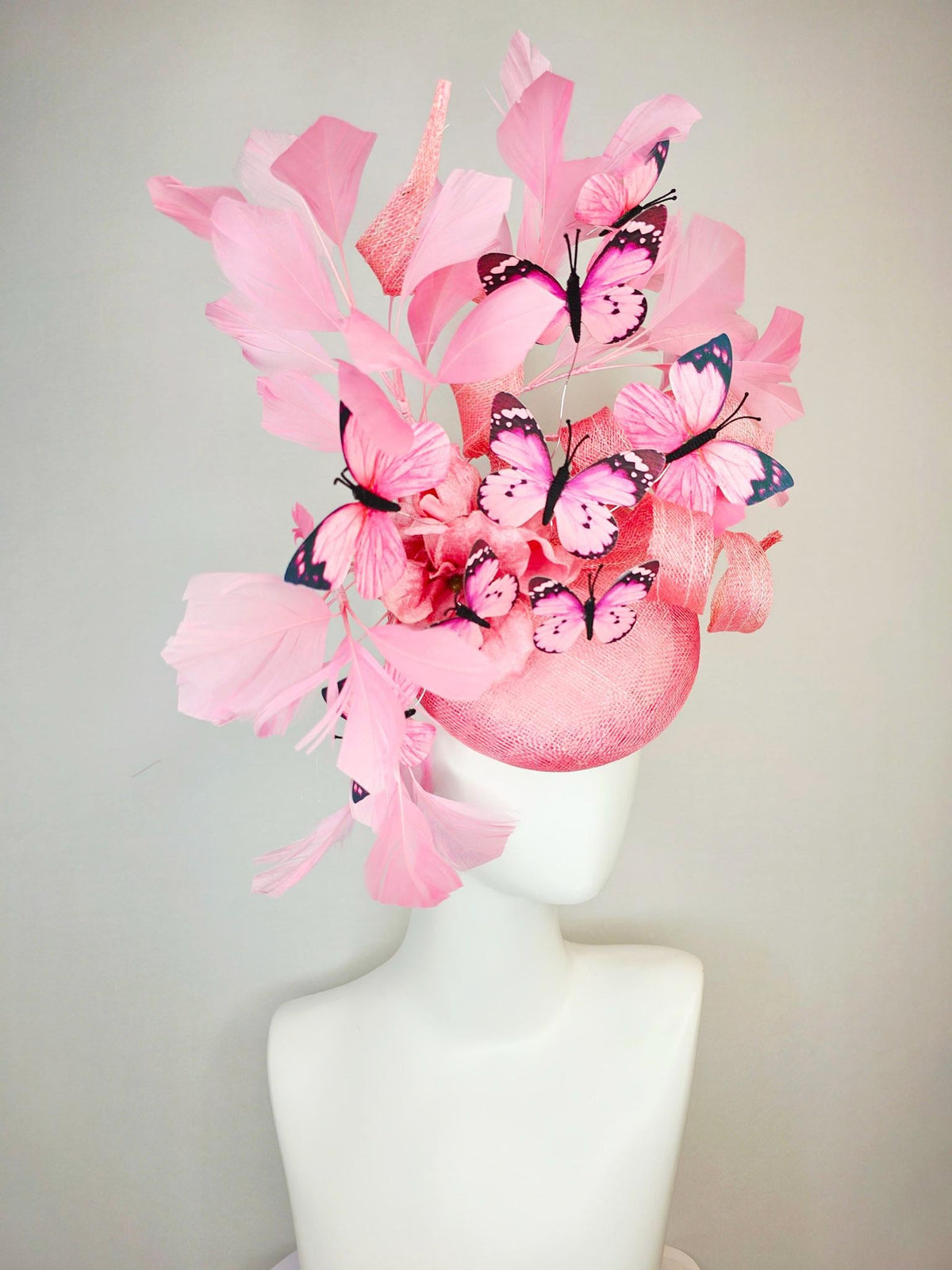kentucky derby hat fascinator dusty pink sinamay with curls rose pink organza flower baby pink feathers light pink and black butterflies
