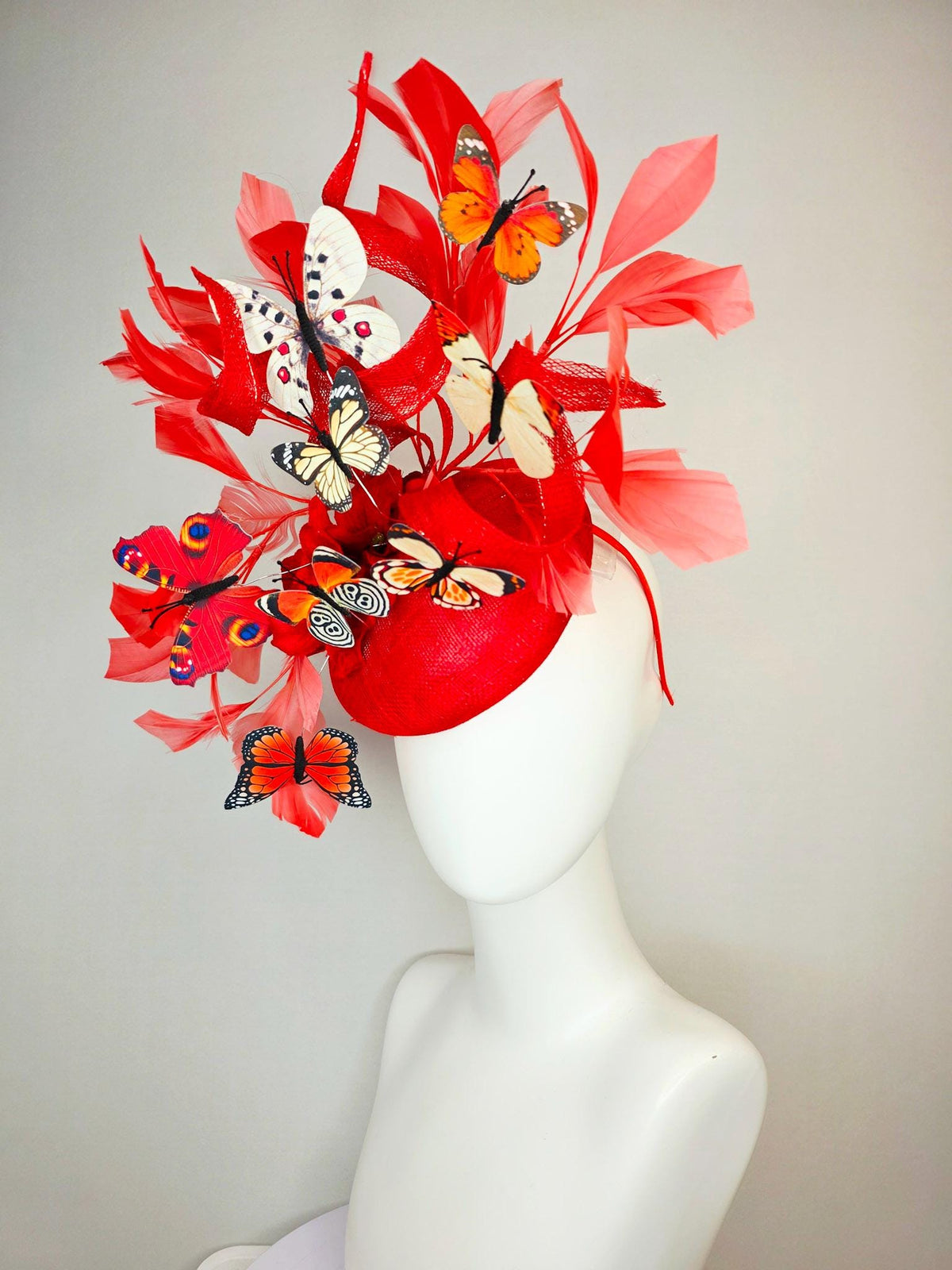 kentucky derby hat fascinator scarlet red sinamay with curls red organza flower coral red feathers white cream orange blue black butterflies