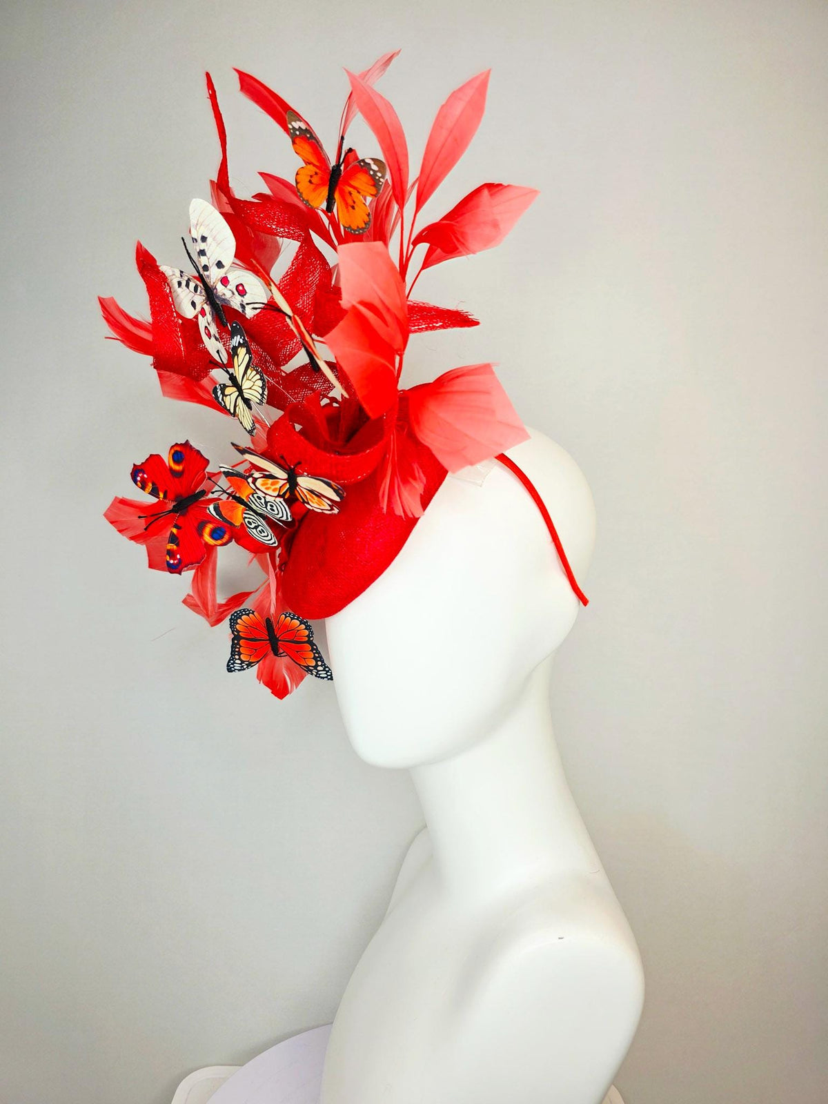 kentucky derby hat fascinator scarlet red sinamay with curls red organza flower coral red feathers white cream orange blue black butterflies