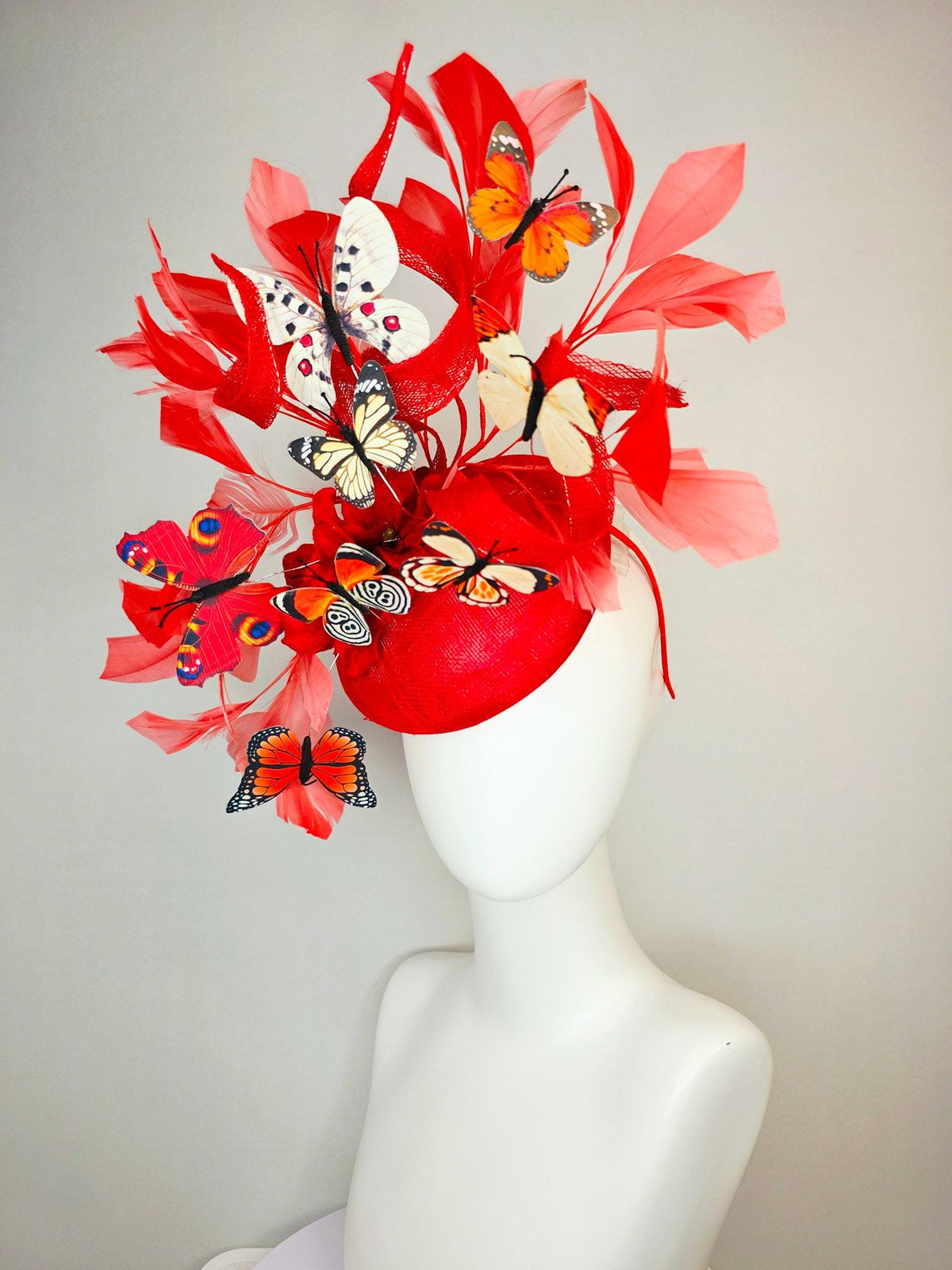 kentucky derby hat fascinator scarlet red sinamay with curls red organza flower coral red feathers white cream orange blue black butterflies