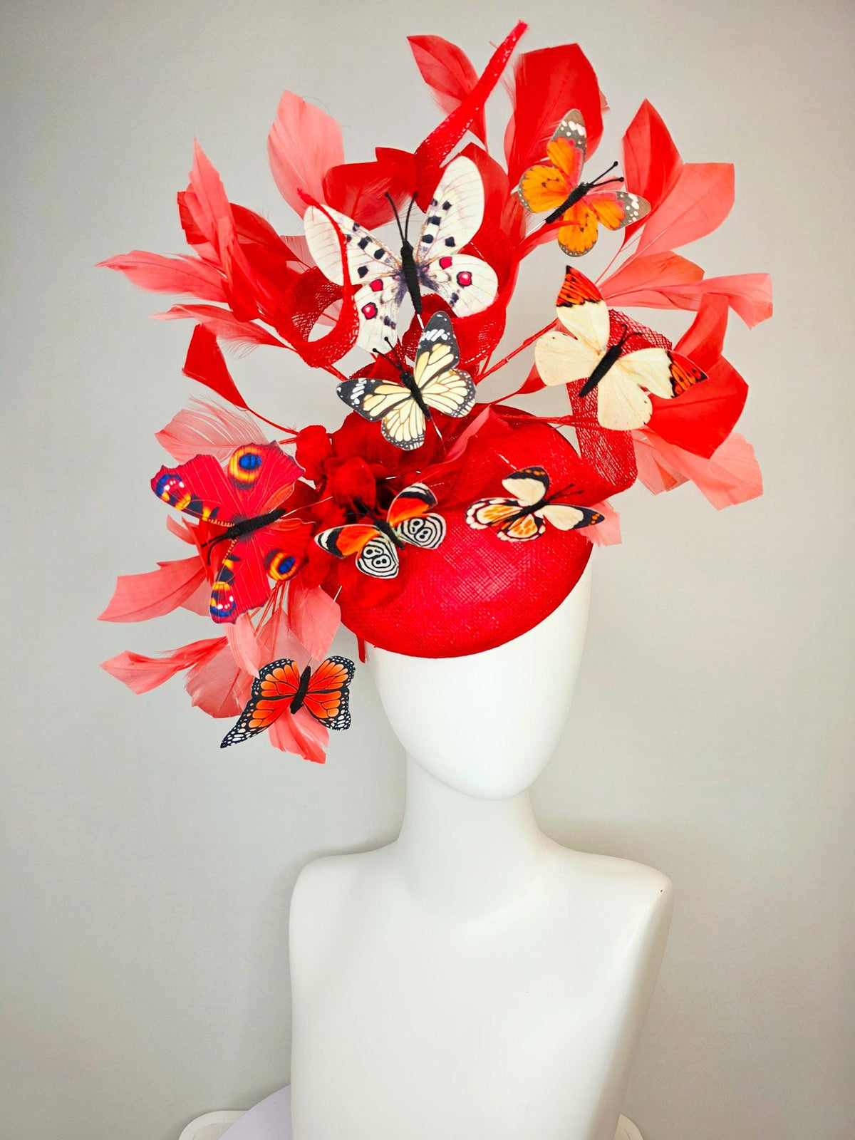 kentucky derby hat fascinator scarlet red sinamay with curls red organza flower coral red feathers white cream orange blue black butterflies