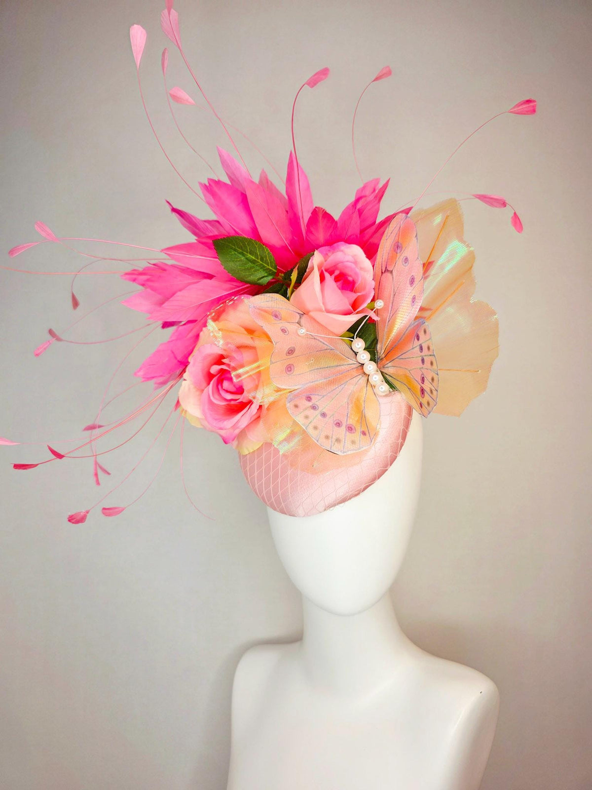 kentucky derby hat fascinator light pink satin with netting ombre peach yellow pink satin roses green leaves pink feathers large butterfly