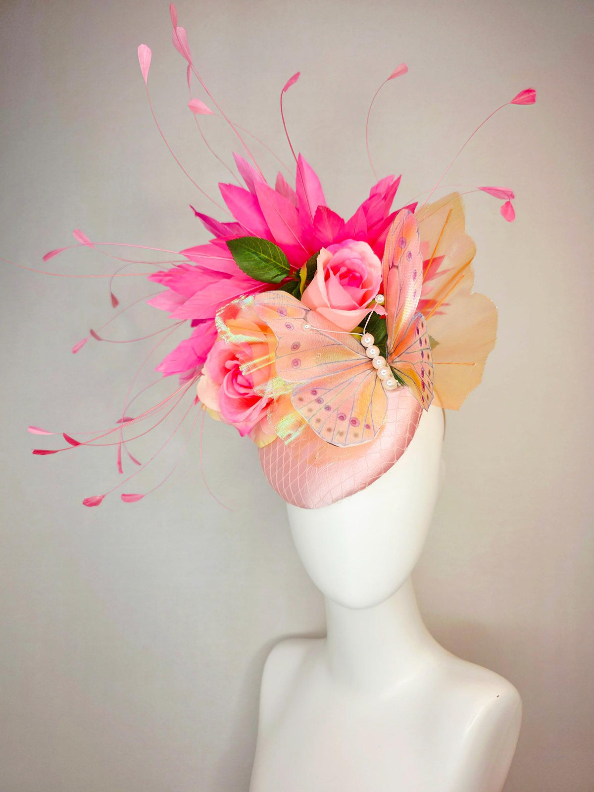 kentucky derby hat fascinator light pink satin with netting ombre peach yellow pink satin roses green leaves pink feathers large butterfly