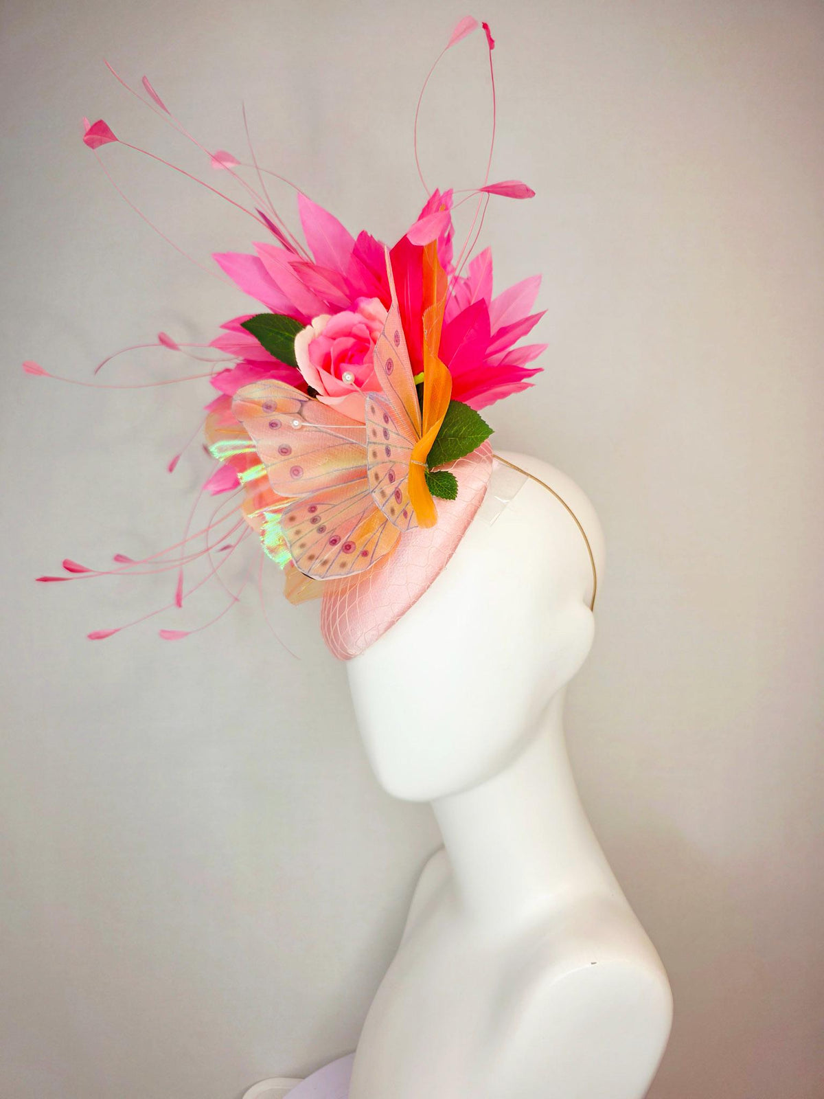 kentucky derby hat fascinator light pink satin with netting ombre peach yellow pink satin roses green leaves pink feathers large butterfly