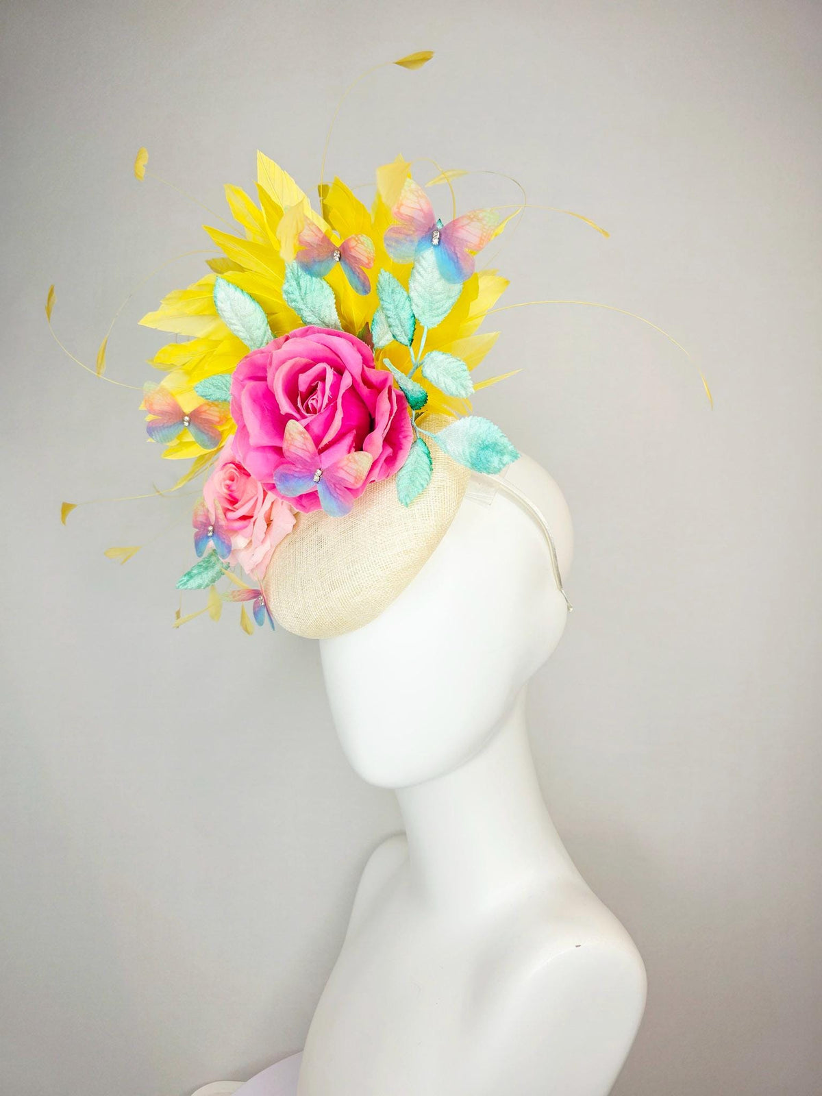 kentucky derby hat fascinator neutral ivory white sinamay and pink satin roses mint green leaves yellow feathers blue blush pink butterflies