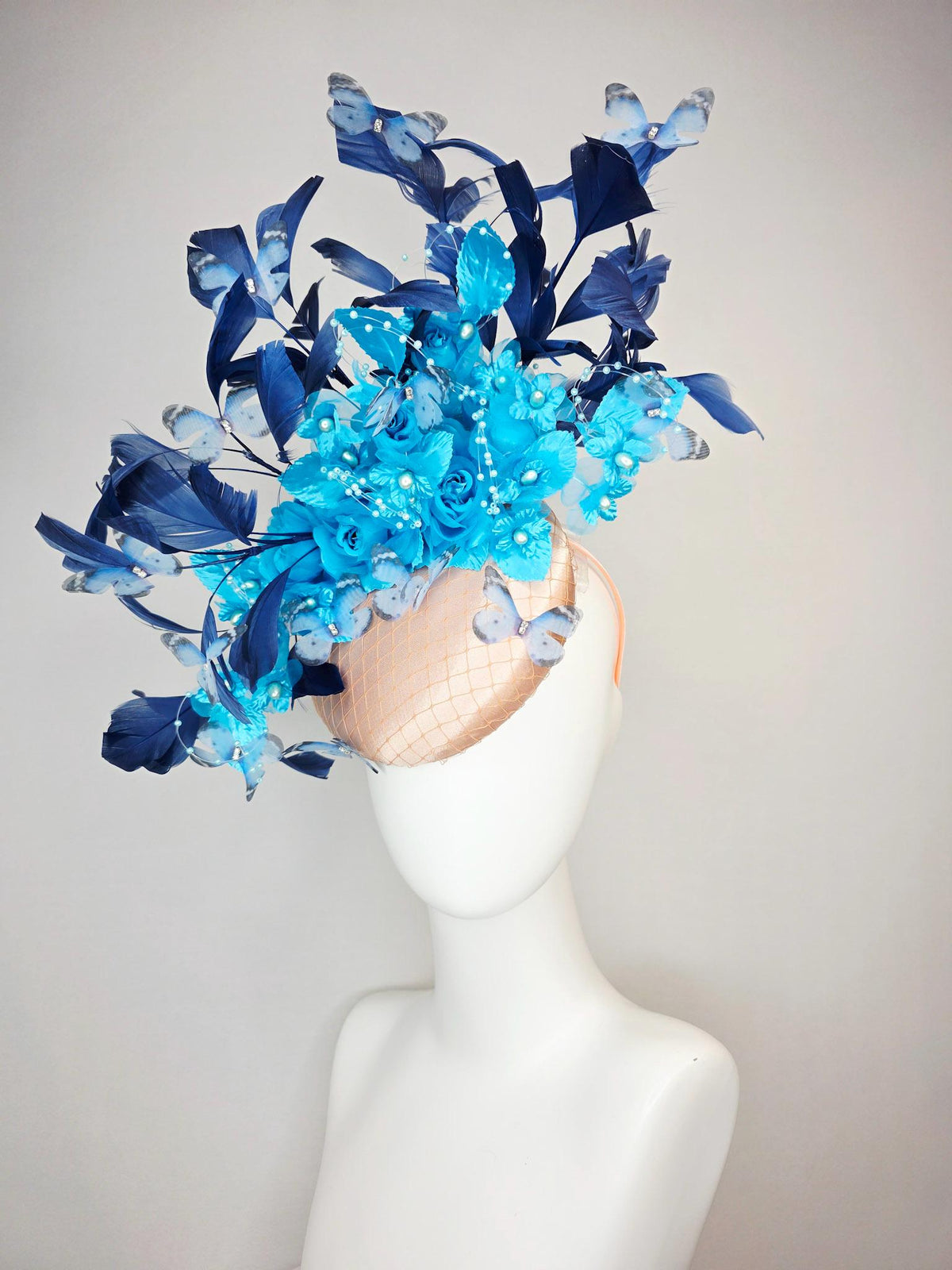 kentucky derby hat fascinator beige satin with netting ocean blue organza roses sky blue satin flowers navy blue feathers blue butterflies