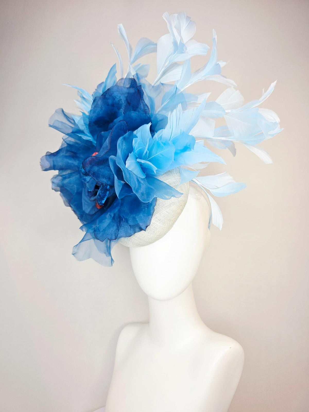kentucky derby hat fascinator ivory white sinamay with large cobalt royal blue organza flower and light baby sky blue branching feathers