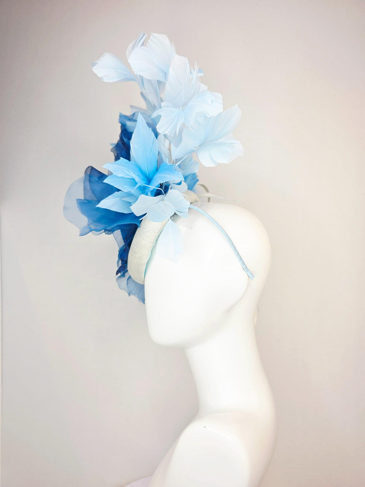 kentucky derby hat fascinator ivory white sinamay with large cobalt royal blue organza flower and light baby sky blue branching feathers